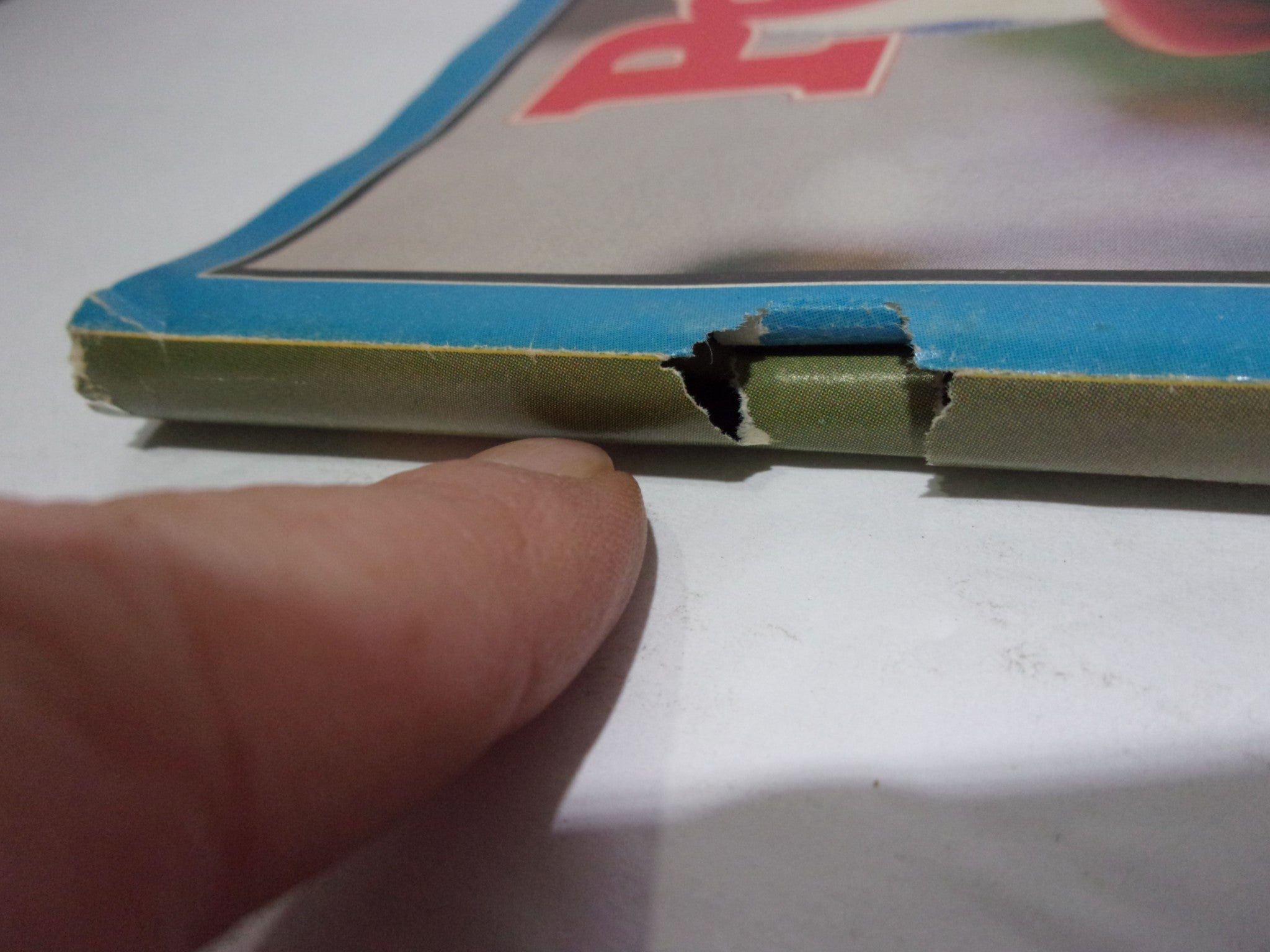 Corner detail of People Weekly Magazine featuring Christa McAuliffe, February 10, 1986, highlighting binding damage.