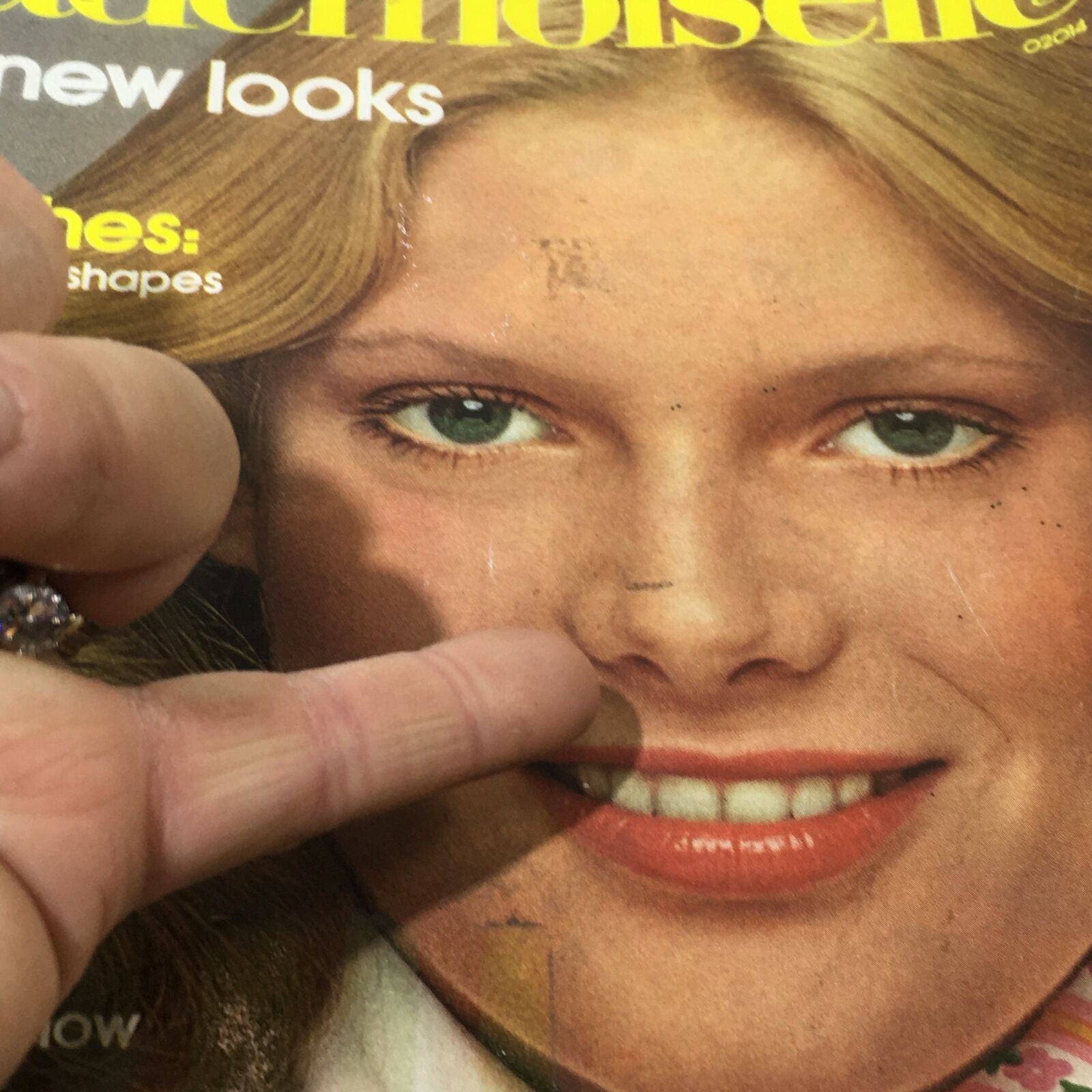 Detailed close-up of Mademoiselle Magazine January 1975 cover highlighting the model's smile and the Great New Looks issue.