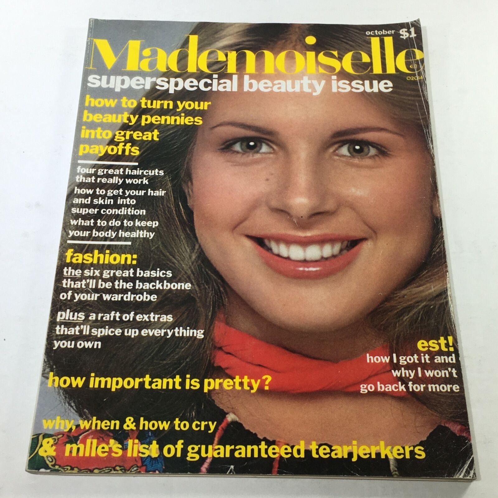 VTG Mademoiselle Magazine: October 1975 cover featuring a portrait of a smiling woman, showcasing beauty tips and fashion advice, highlighting the vintage aesthetic and charm of the 1970s.