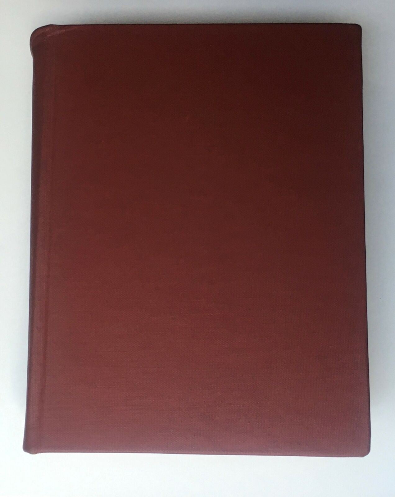 The hardcover exterior of the 1974 Woman's Day Magazine compilation, featuring a solid maroon cover, highlighting the vintage appeal of this complete year-round collection.