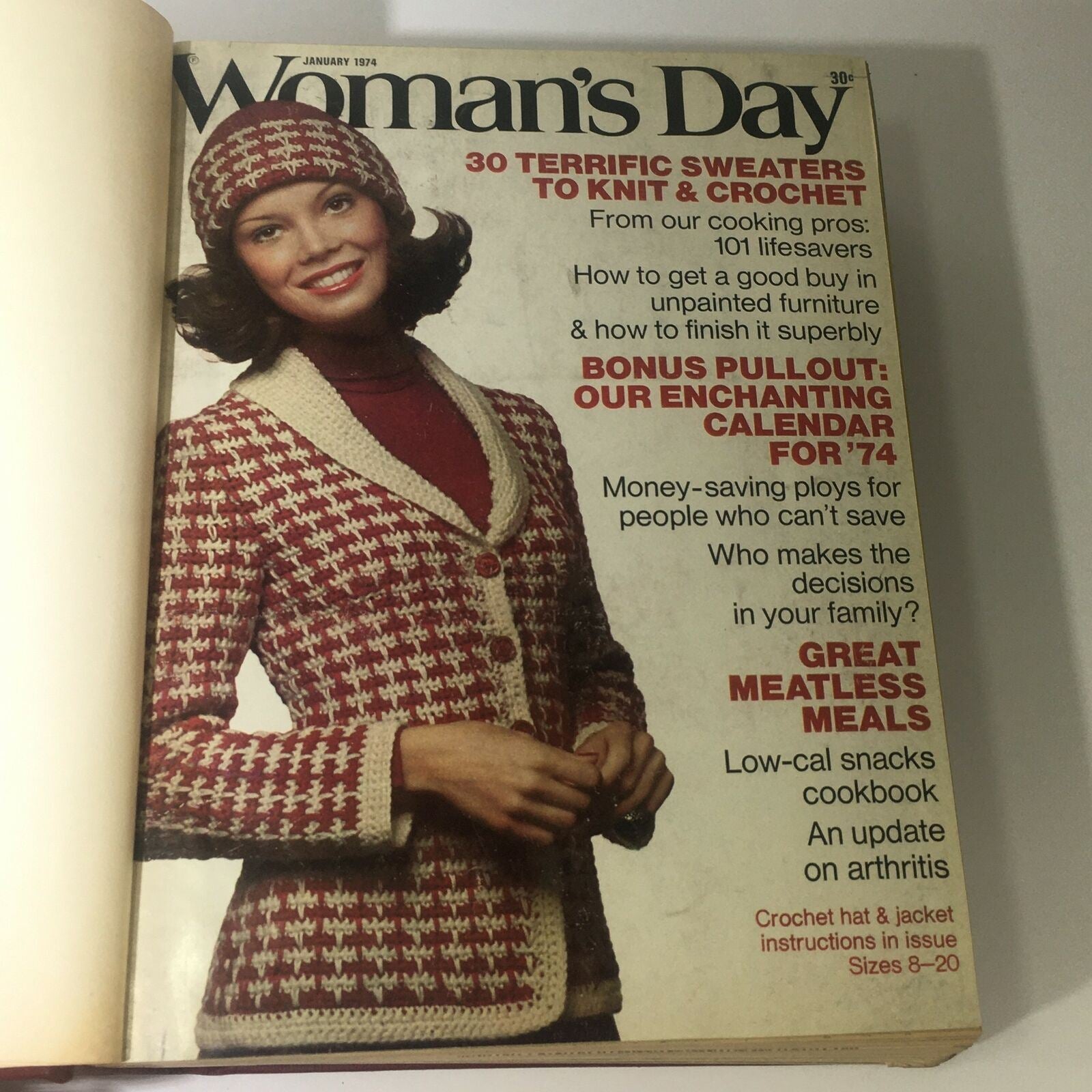 Cover image of the 1974 Woman's Day Magazine featuring a woman in a stylish knitted outfit, with a headline highlighting sweaters to knit and crochet, included in the compilation, 1974 Woman's Day Magazine Complete Year Round In One Bound Book Compilation.