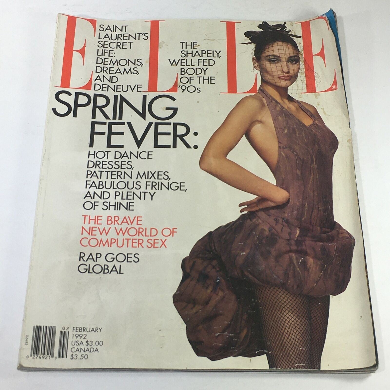 VTG Elle Magazine: February 1992 featuring Brenda Schad on the cover, showcasing a fashion theme with the headline 'Spring Fever.' The cover highlights a unique dress design and includes text regarding dance dresses and the influence of computer sex.