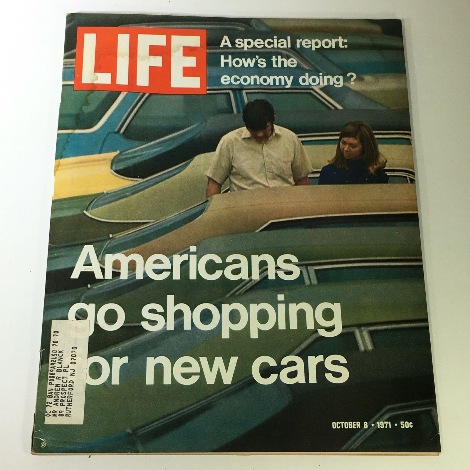 Vintage Life Magazine cover from October 8, 1971, featuring the title 'Americans Go Shopping For New Cars' with two individuals looking at cars.