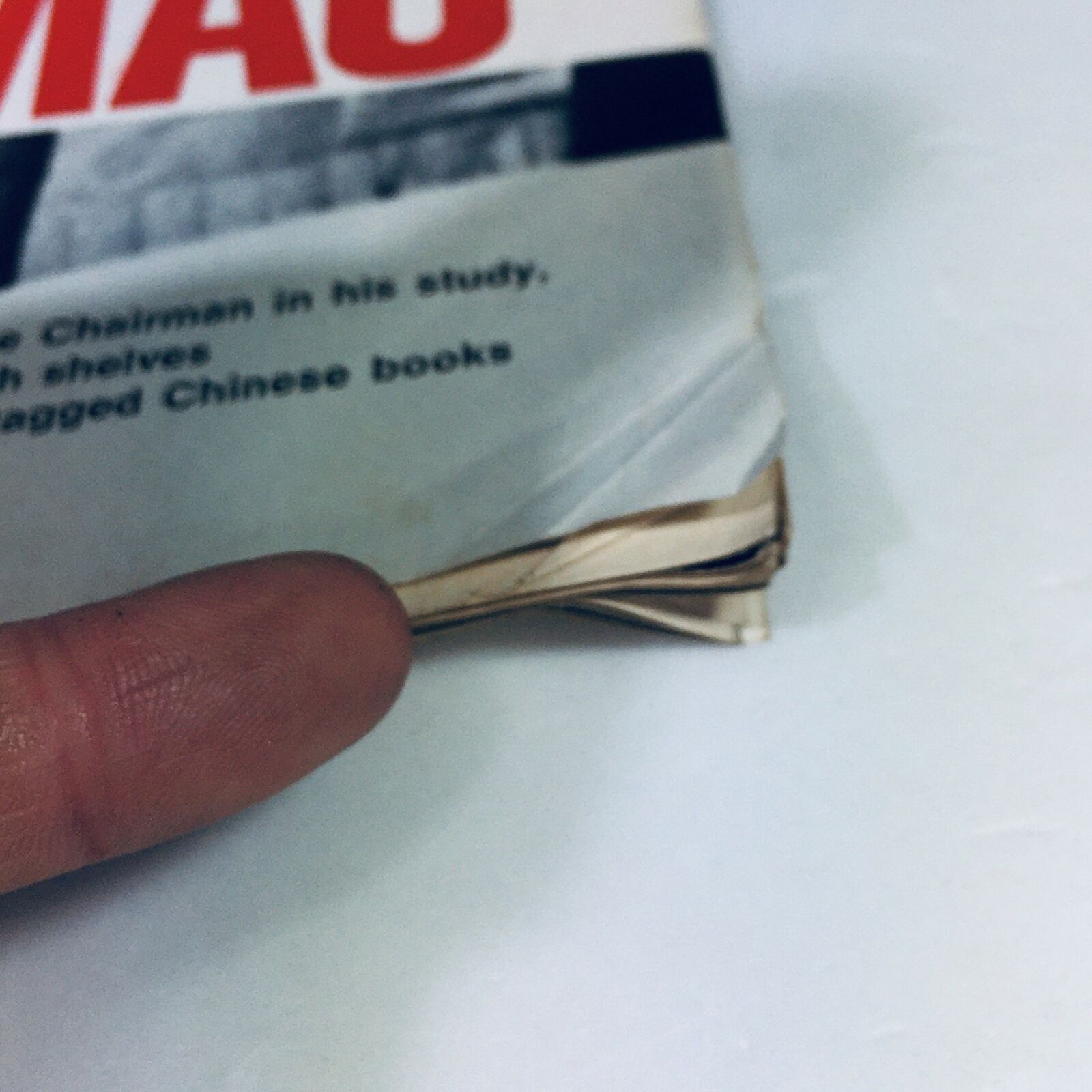 Close-up of the damaged edge of VTG Life Magazine March 3 1972, highlighting wear while depicting Nixon's historic visit to Mao's China.