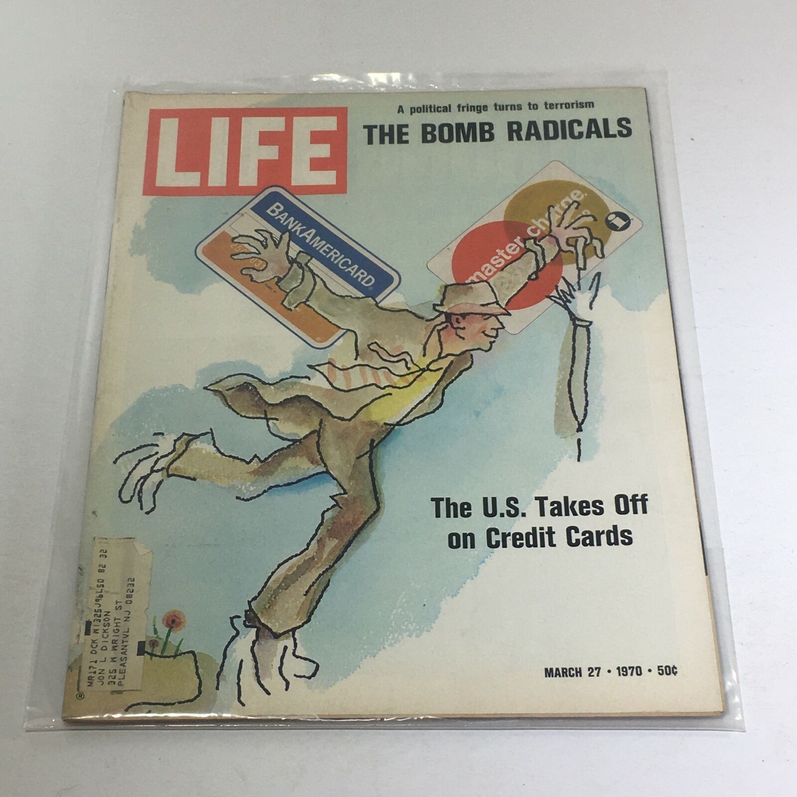 Cover of Vintage Life Magazine from March 27, 1970, featuring the article 'The U.S. Takes Off on Credit Cards' with an illustration of a man holding credit cards, a reflection of the era's shifting consumer habits.