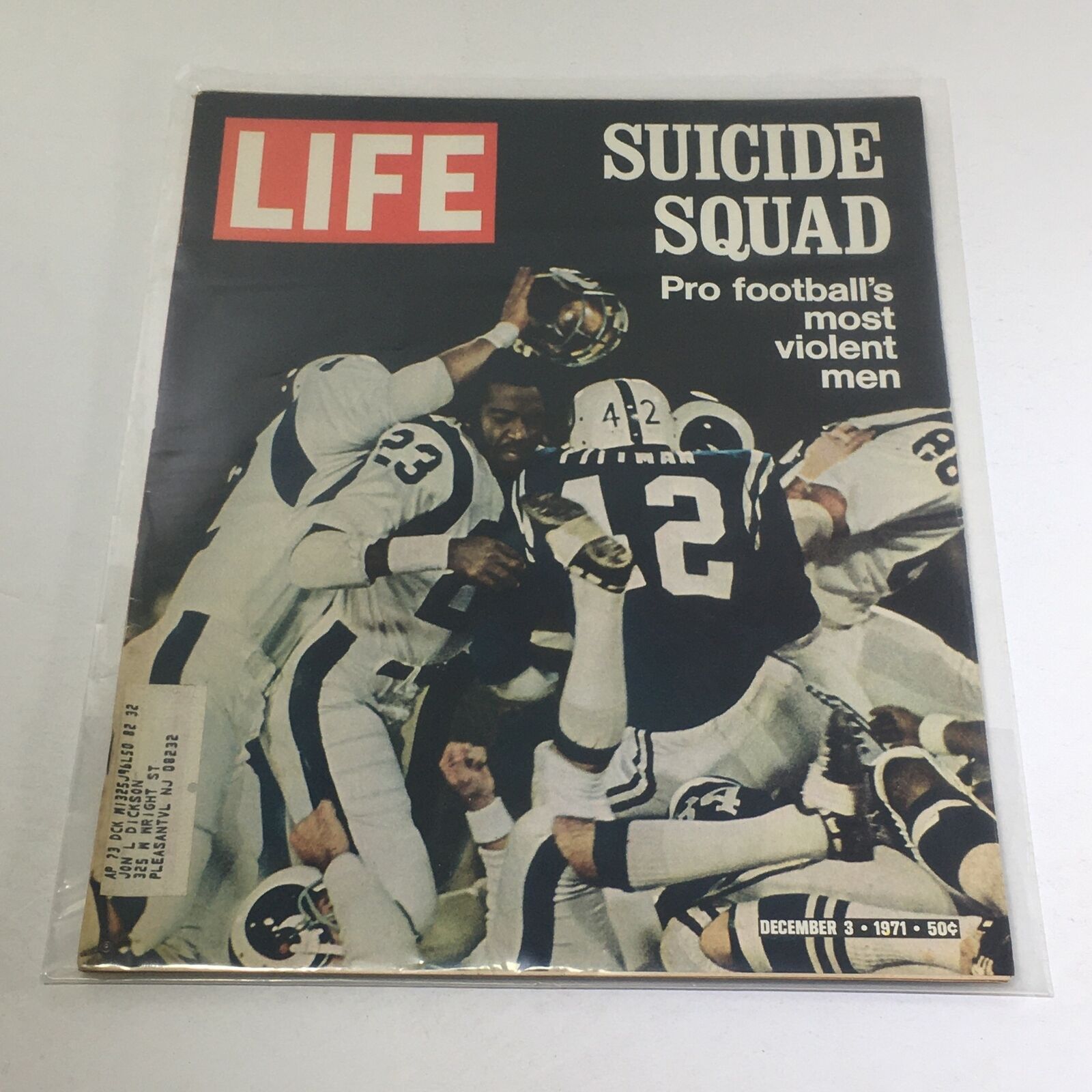 Cover of Vintage Life Magazine dated December 3, 1971, featuring the headline 'Suicide Squad: Pro football's most violent men', showcasing an intense football scene with players in action.