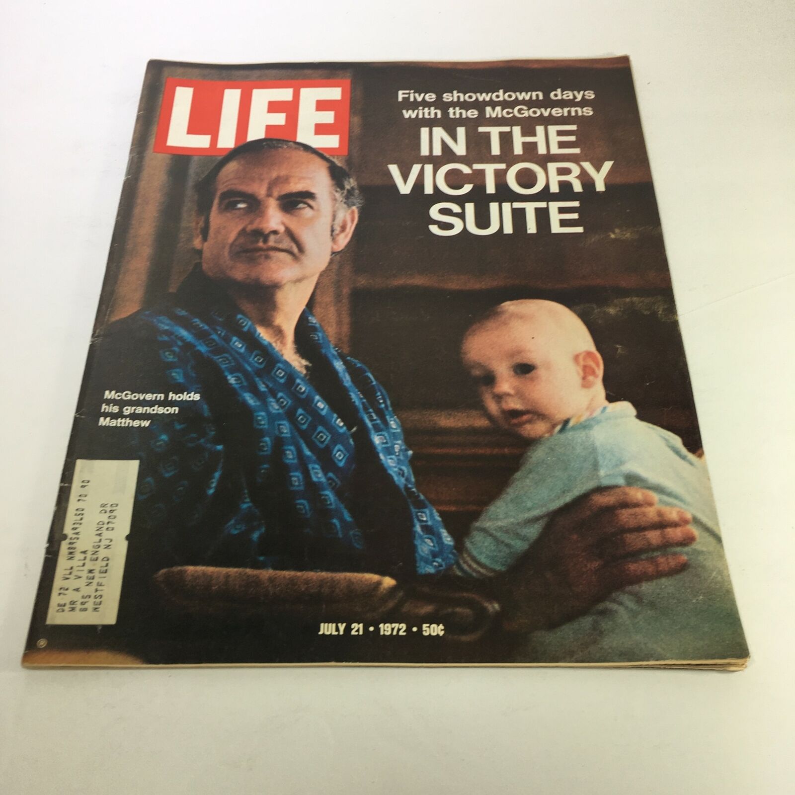 Cover of Life Magazine from July 21, 1972, featuring the title 'Five Showdown Days with the McGoverns'. The image shows a man holding a baby, emphasizing a familial moment amidst the political narrative of the magazine.