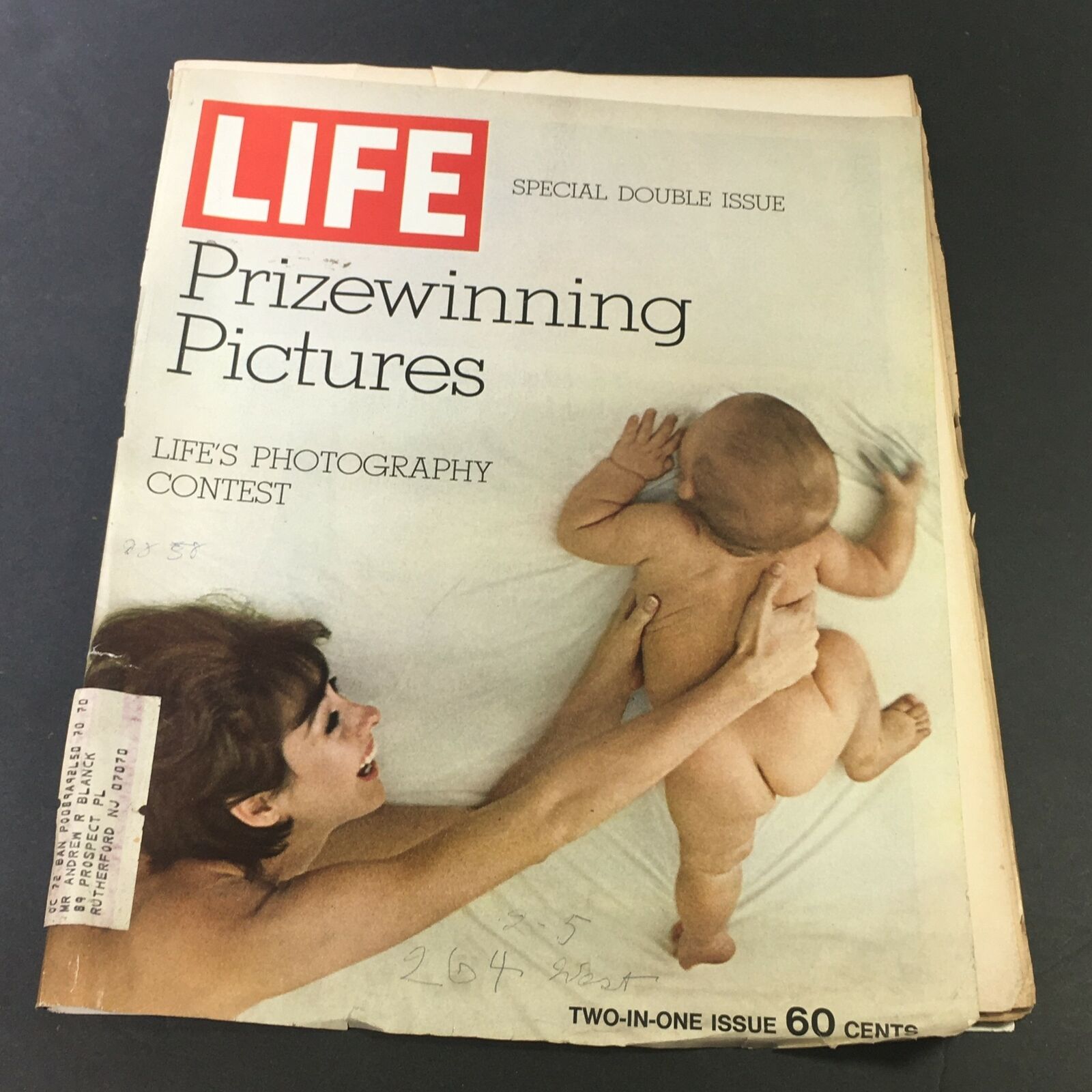 Vintage Life Magazine Cover from December 25, 1970, featuring the title 'Life's Photography Contest Prizewinning' showcasing a mother and baby.