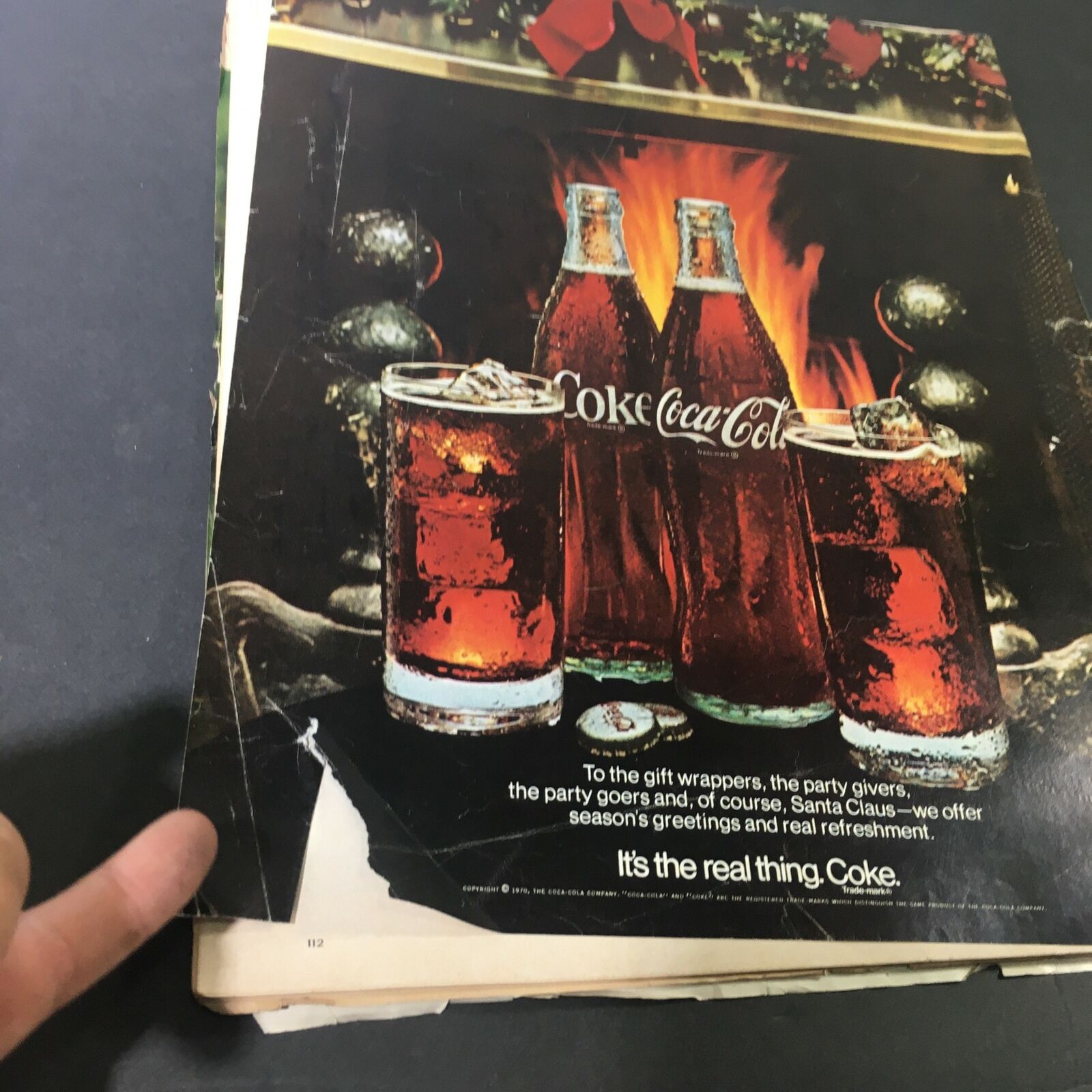 The back cover of a vintage Life Magazine from December 25, 1970, featuring a Coca-Cola advertisement with visible wear and tears, showcasing the magazine's history.