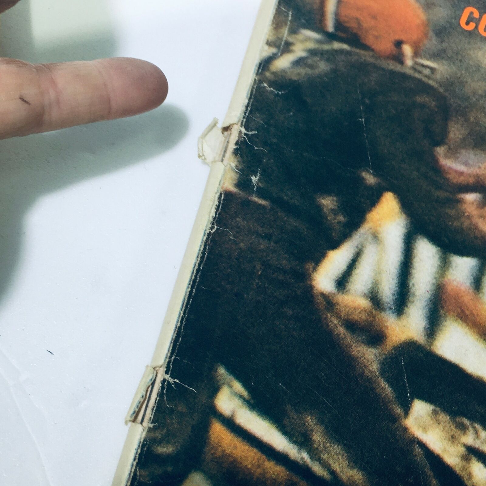 Close-up of the spine of VTG Life Magazine October 14, 1966 highlighting wear and an address label on the cover, illustrating its vintage character.
