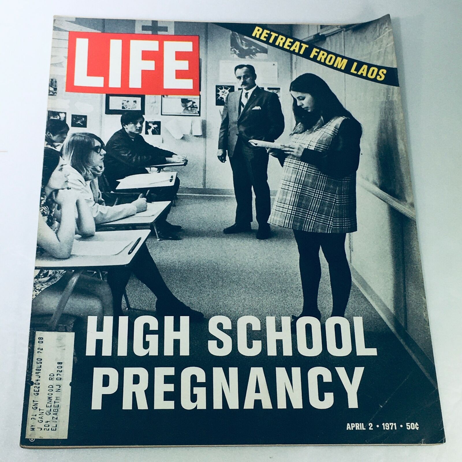 Cover of VTG Life Magazine April 2 1971 featuring the headline 'Retreat from Laos' and a feature on 'High School Pregnancy', showcasing a classroom scene with students and a teacher.
