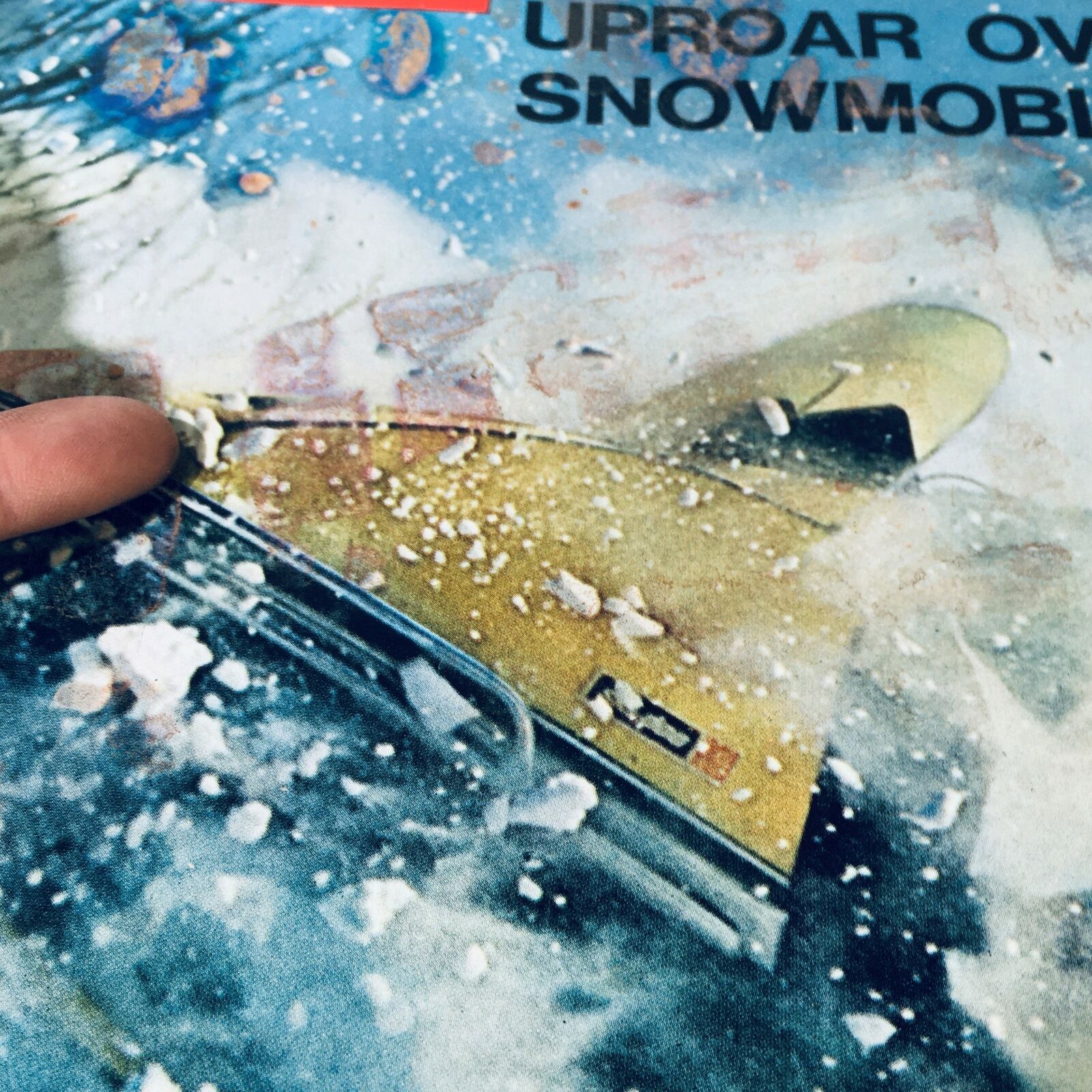 Detailed view of the cover art from VTG Life Magazine February 26 1971, highlighting the dramatic snow scene with snowmobiler Arthur Mason.