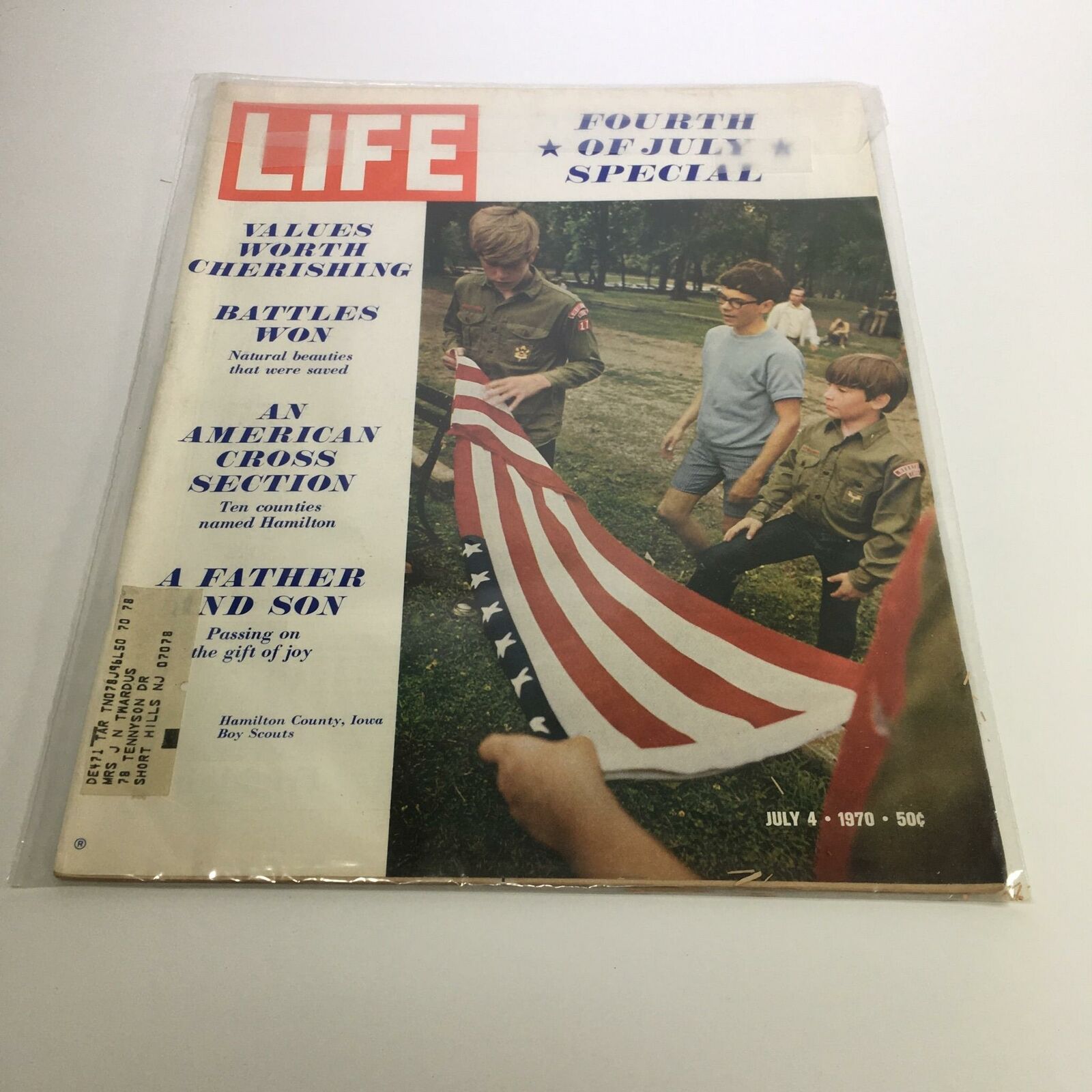 Cover of Life Magazine, July 4, 1970, featuring the title 'An American Cross Section' with a focus on Hamilton counties; depicts Boy Scouts carrying an American flag in a park setting, showcasing themes of patriotism, community, and youth engagement.