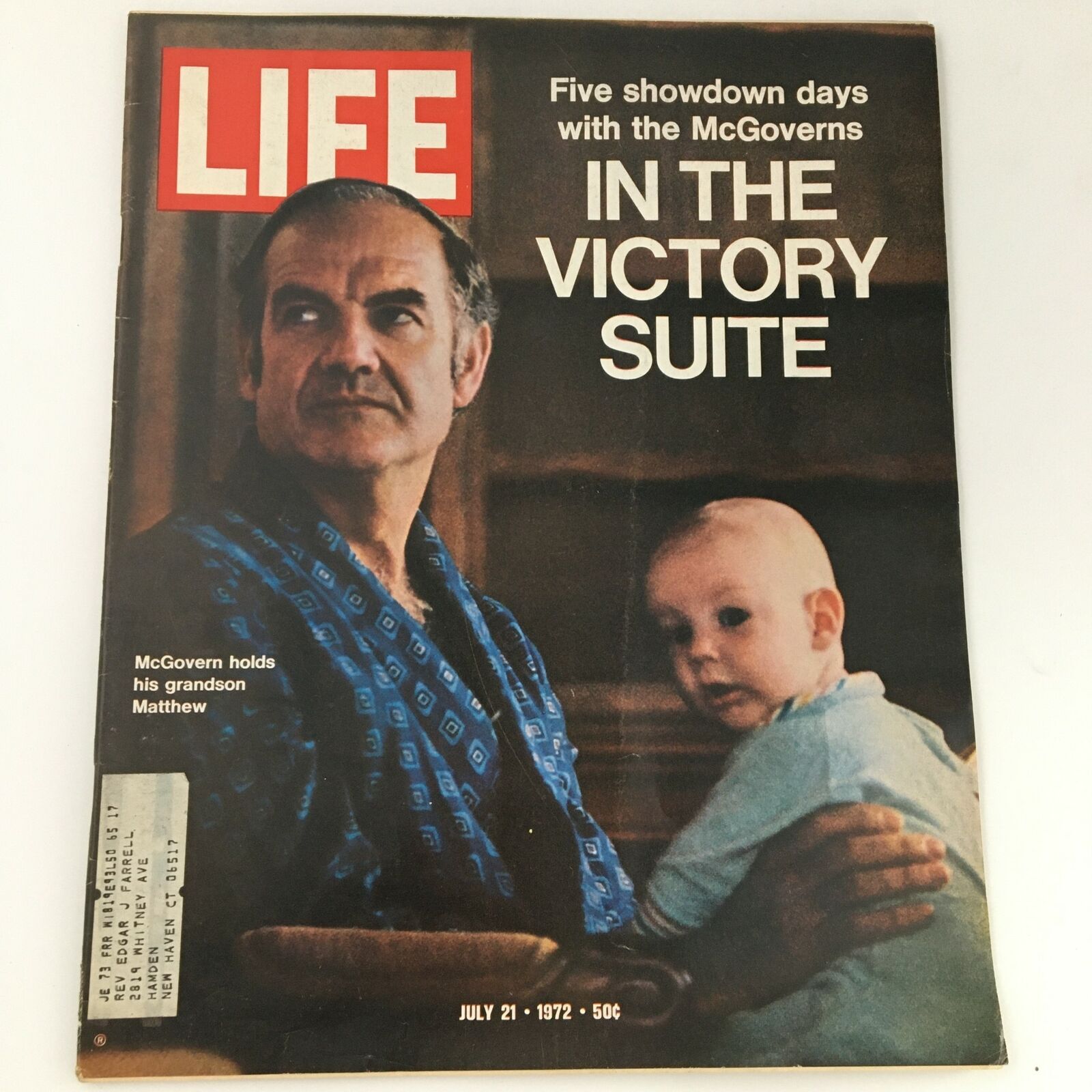 Cover of VTG Life Magazine dated July 21, 1972, featuring George McGovern with his grandson Matthew, highlighting a captivating political feature. The cover showcases McGovern's serious expression, while the magazine title prominently displays 'LIFE'.