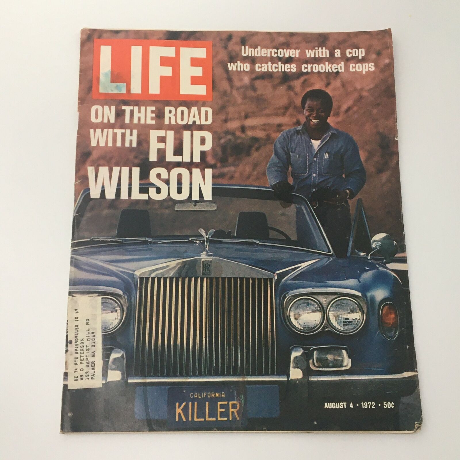 VTG Life Magazine August 4 1972 Comedian Flip Wilson Cover featuring Flip Wilson beside a classic car with a notable license plate, offering a nostalgic glimpse into the 1970s entertainment culture.