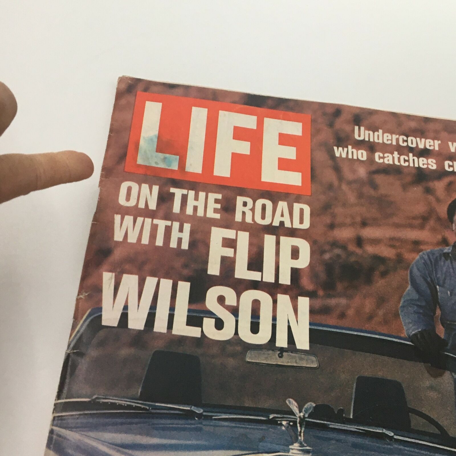 Close-up view of the cover of VTG Life Magazine August 4 1972 featuring comedian Flip Wilson, showcasing the title and a brief description of the article.