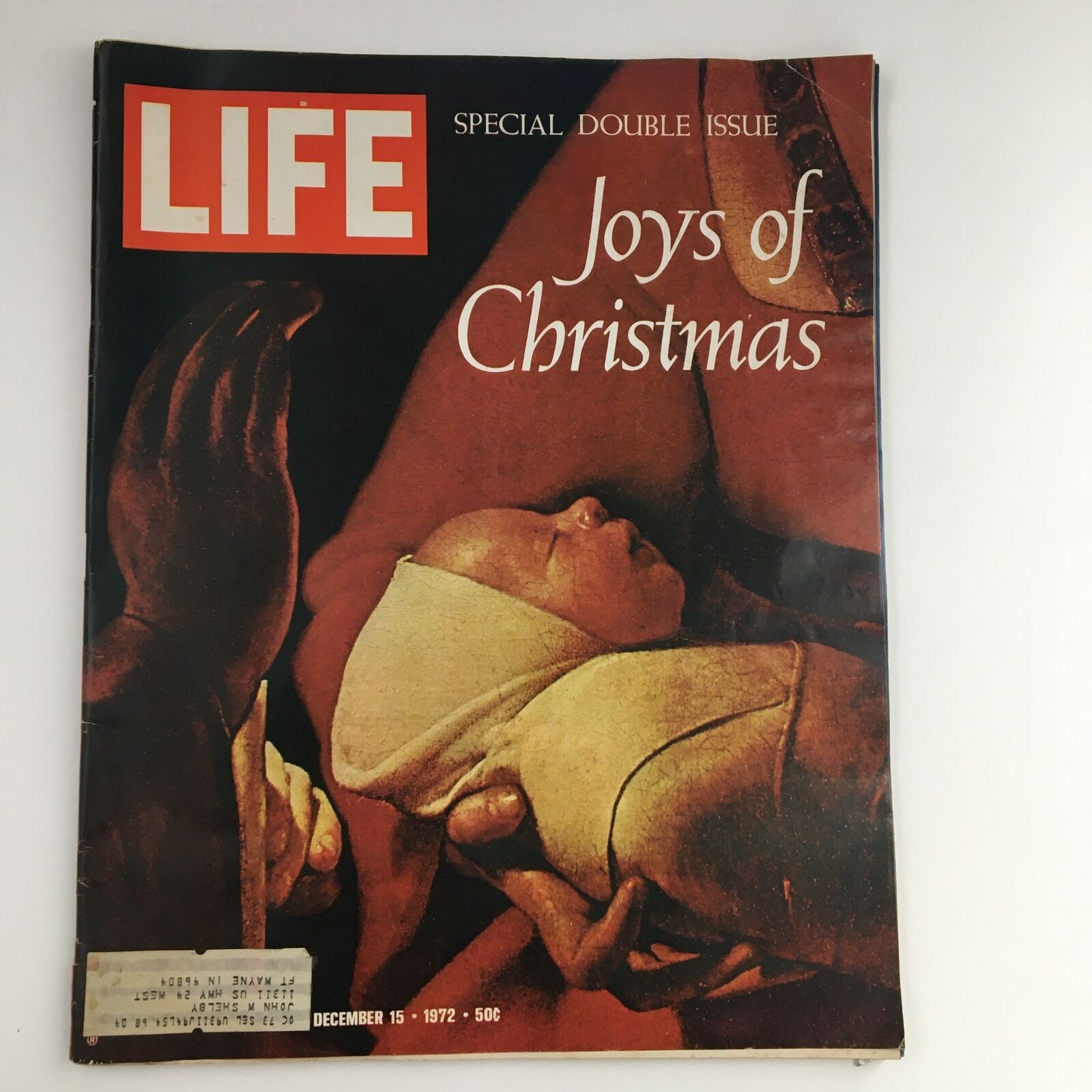 Life Magazine December 15, 1972, Special Double Issue titled 'Joys of Christmas' featuring a cover image of a baby being held, encapsulating the warmth of the holiday season.
