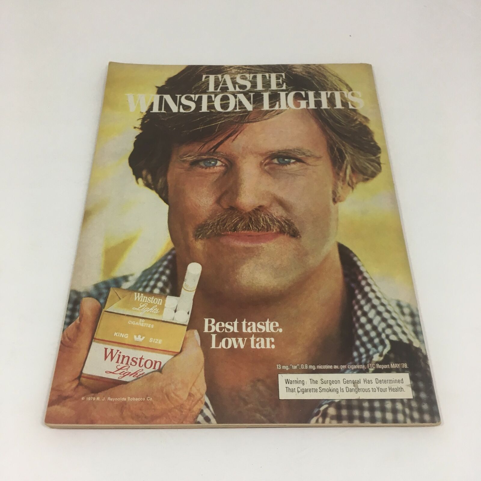 Cover of Time Magazine: John Paul Superstar Special: Album of His Journey from October 15, 1979, featuring a man holding Winston Lights cigarettes. The magazine highlights Pope John Paul II's journey, capturing his charisma and leadership.