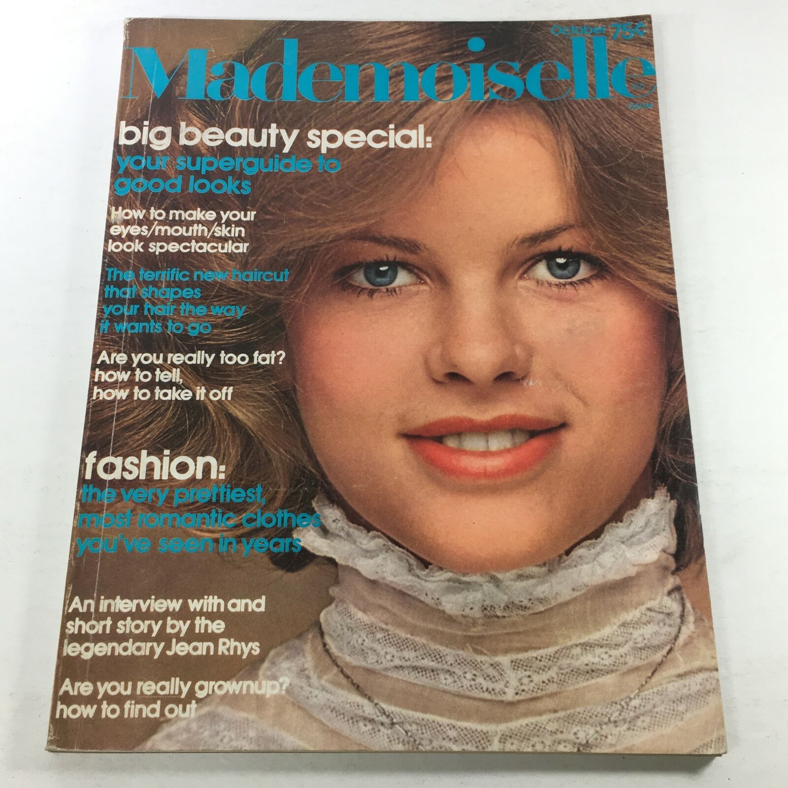 Vintage Mademoiselle Magazine from October 1974 featuring a beauty and fashion cover with a smiling model, showcasing makeup and hairstyle trends of the 1970s.