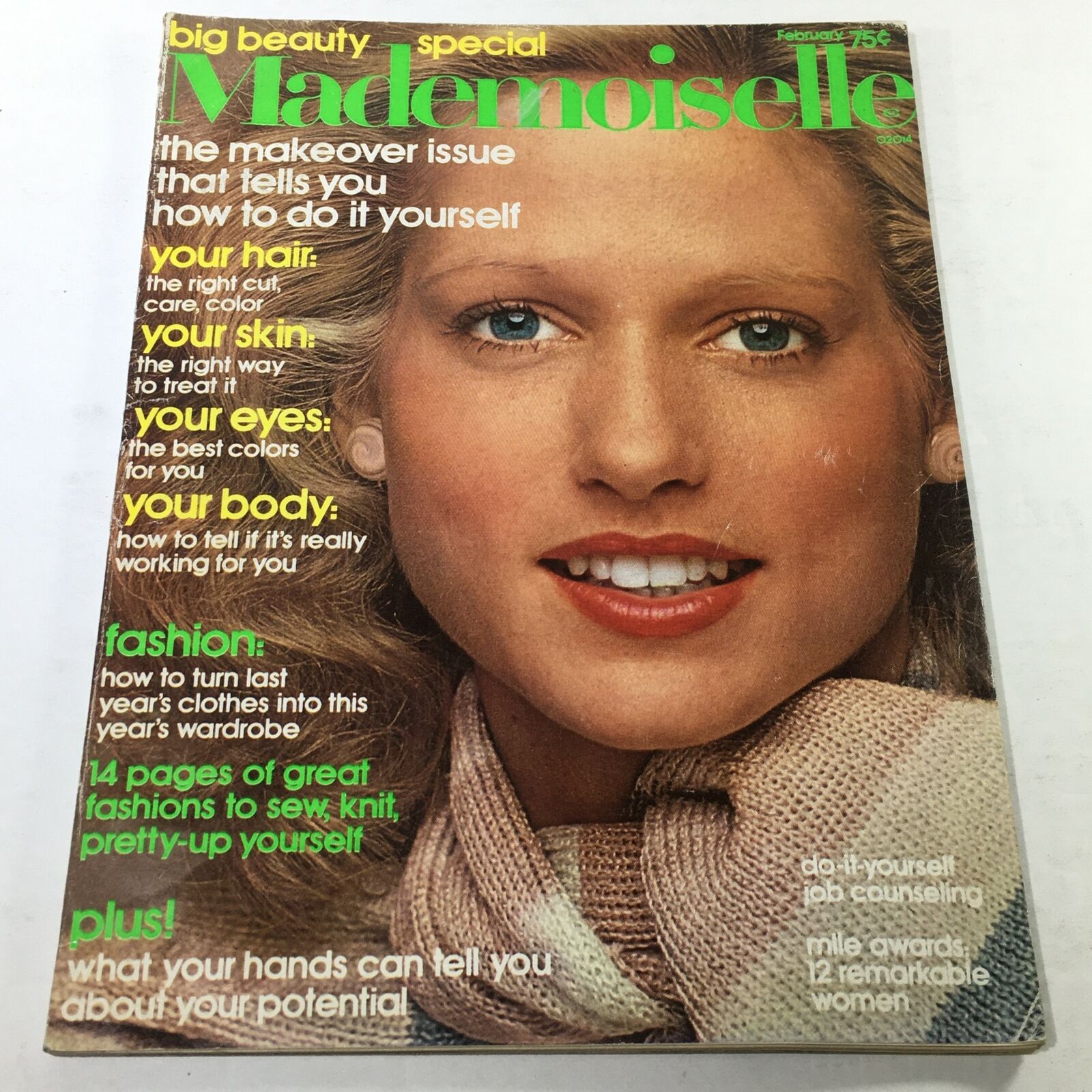 Cover of VTG Mademoiselle Magazine: February 1975 featuring a beautiful model showcasing a makeover theme. The cover highlights beauty tips such as hair, skin, eyes, and body, reflecting 1970s fashion trends.