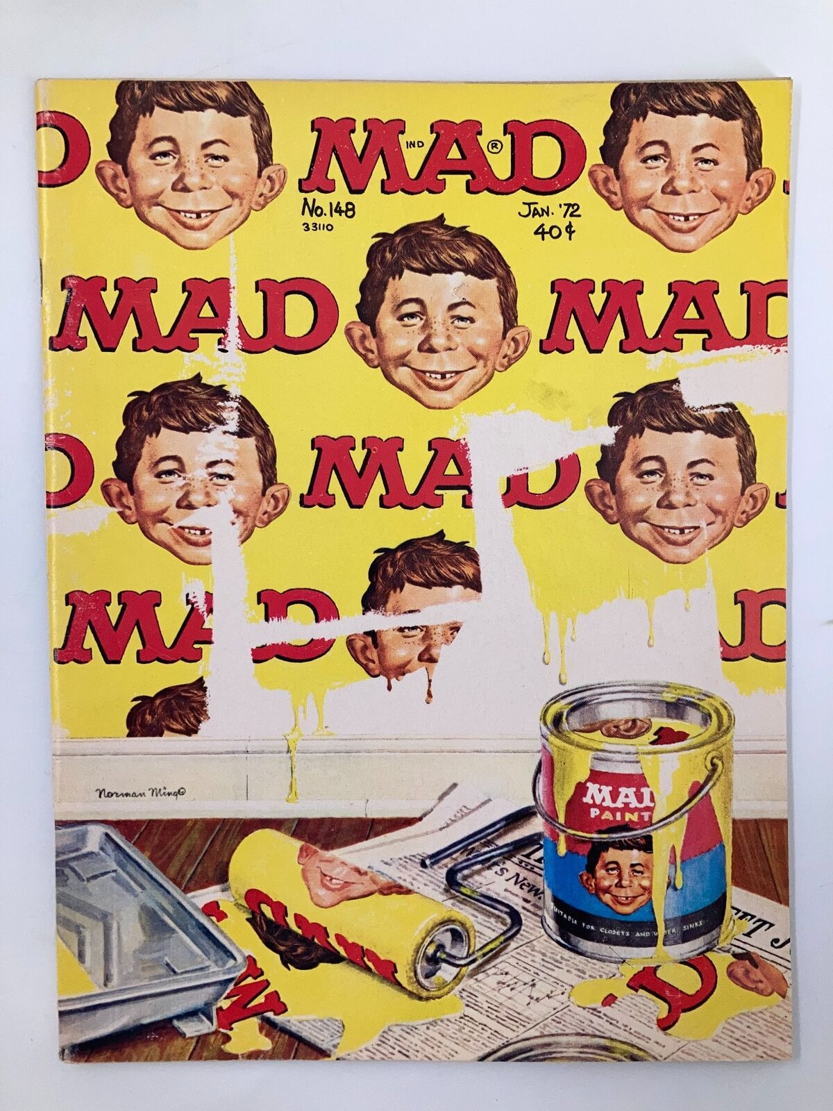 Cover of Mad Magazine January 1972 No. 148 featuring Alfred E. Neuman with vibrant yellow background and paint cans, showcasing vintage humor and pop culture.