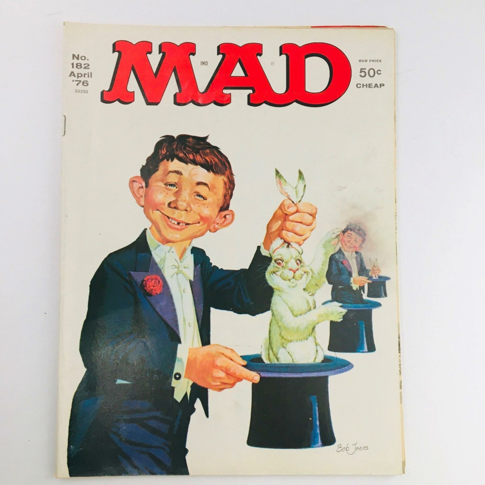 Cover of Mad Magazine April 1976 No. 182 featuring the 'Rabbit Out The Hat' illustration with a smiling character in a tuxedo holding a rabbit, showcasing the magazine’s vintage appeal and humor.