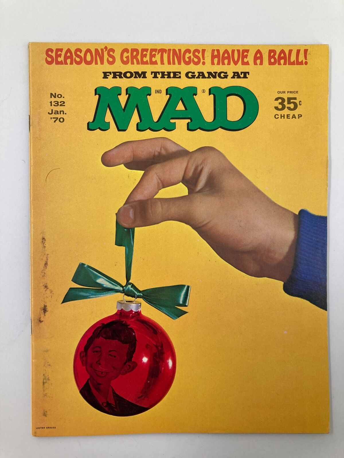 Cover of Mad Magazine January 1970 No. 132 featuring the headline 'Season's Greetings! Have A Ball!' with a hand holding a red ornament and a green ribbon against a bright yellow background, in Very Good condition.