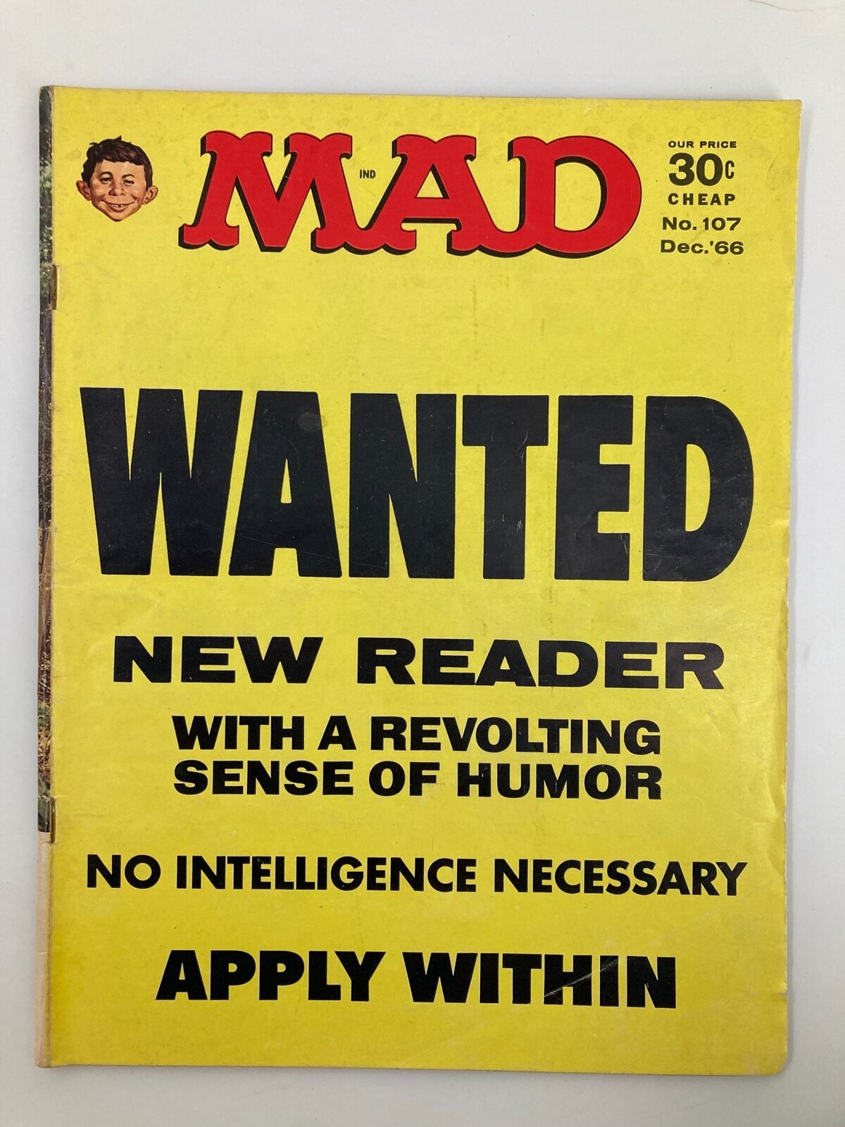 Cover of Mad Magazine December 1966 No. 107 featuring the title 'Wanted: New Reader' in bold black letters on a bright yellow background, with a humorous call for readers. The magazine is in Very Good condition, ideal for collectors.