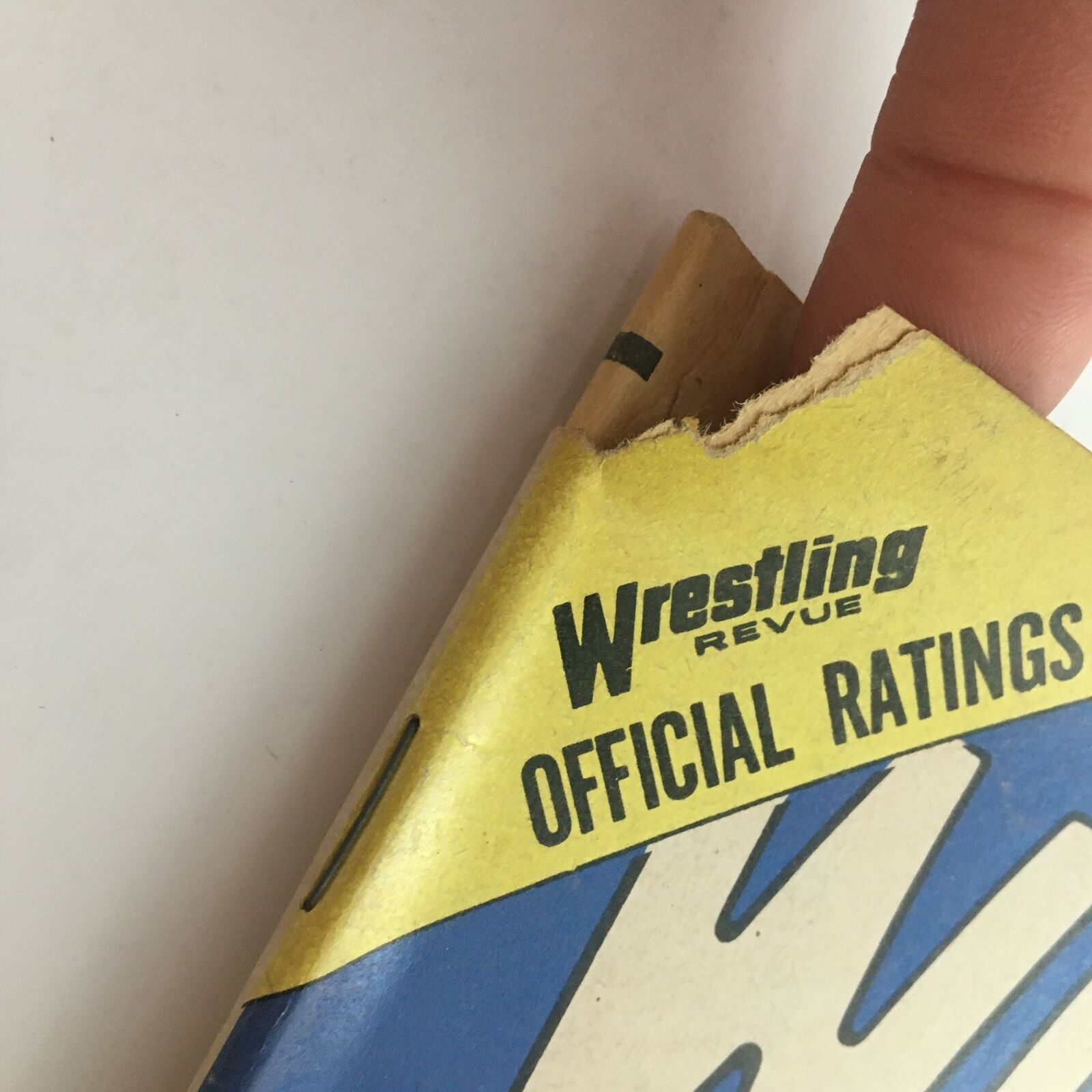Close-up of the top spine of Wrestling Revue Magazine October 1974 showing minor damage. This vintage magazine features Bruno Sammartino vs Jonathan on the cover.