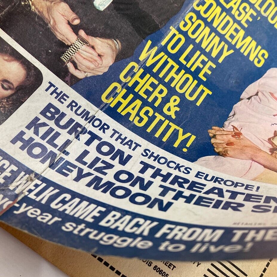 Close-up of the December 1973 Movie Life Magazine cover featuring bold headlines about Elizabeth Taylor and Richard Burton's rumored drama, along with other celebrity news.