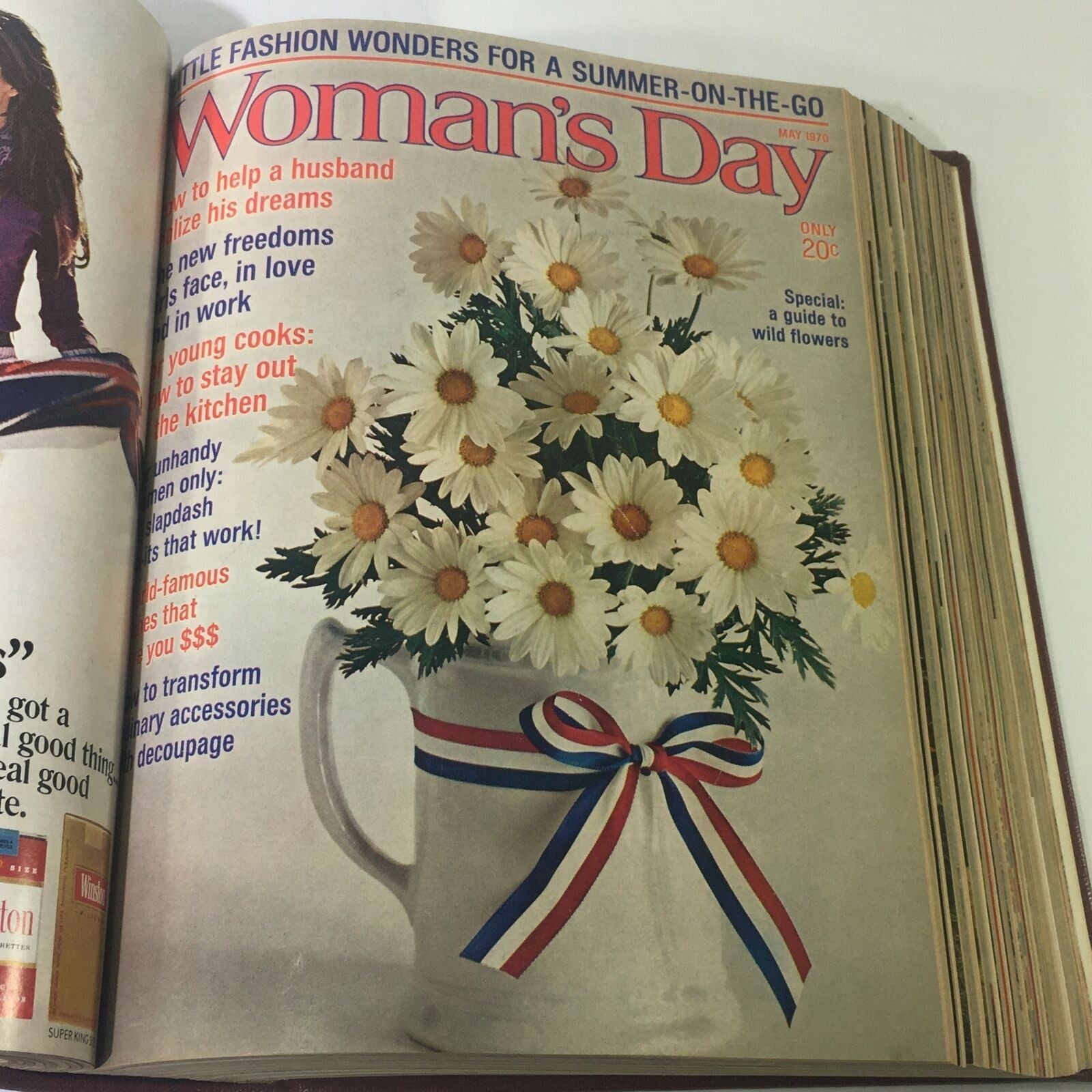 Cover of May 1970 Woman's Day Magazine showcasing a bouquet of daisies in a mug, illustrating seasonal home decoration ideas.