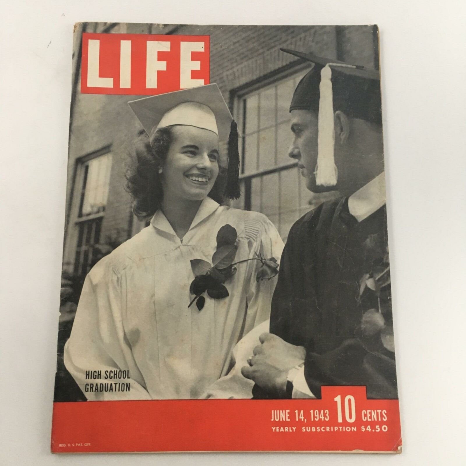 Cover of VTG Life Magazine from June 14, 1943 featuring High School Graduation, showcasing a joyful graduate and a male figure in traditional graduation attire.