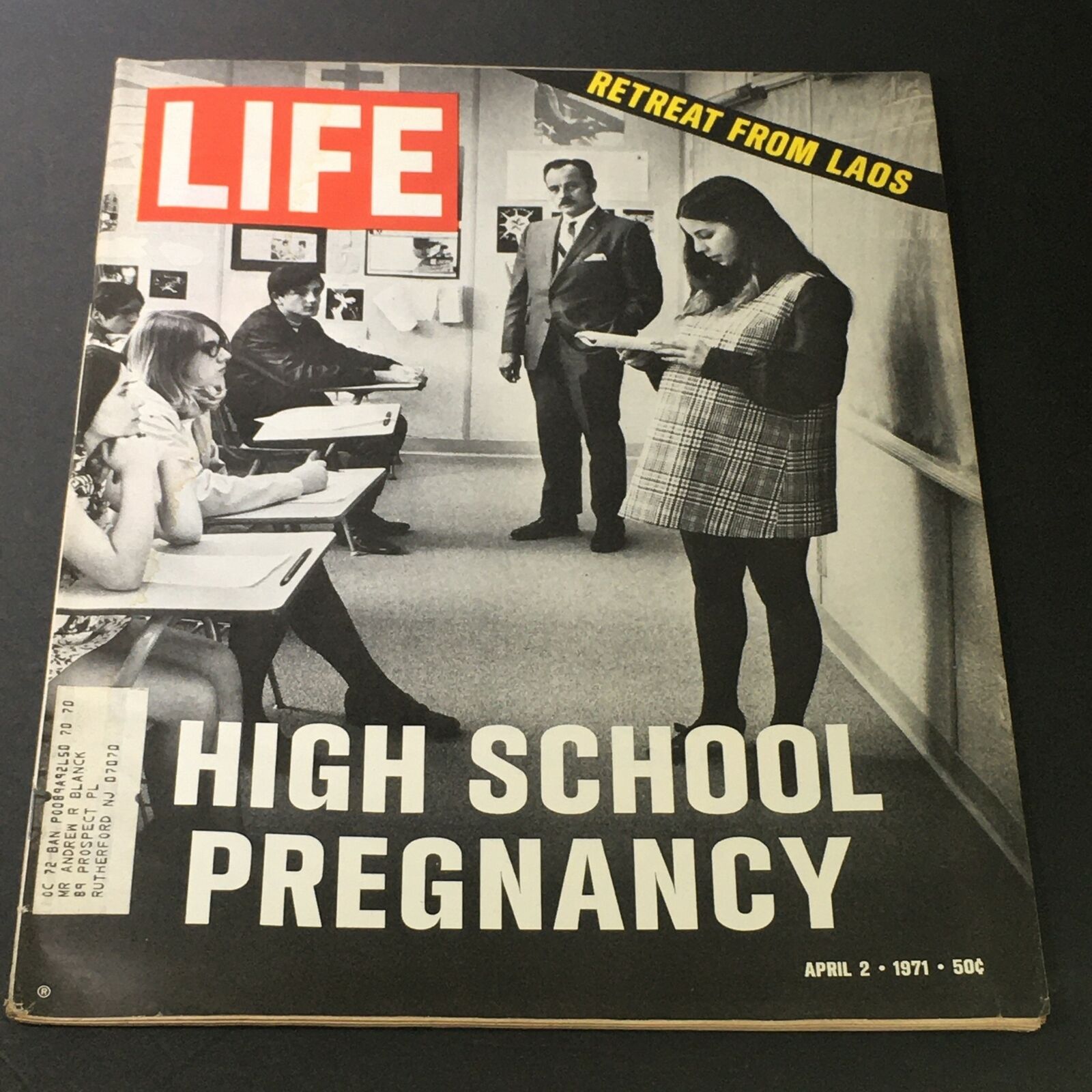 VTG Life Magazine April 2 1971 featuring a cover story on High School Pregnancy and the Retreat From Laos, depicting students in a classroom setting with a teacher and notable vintage design.