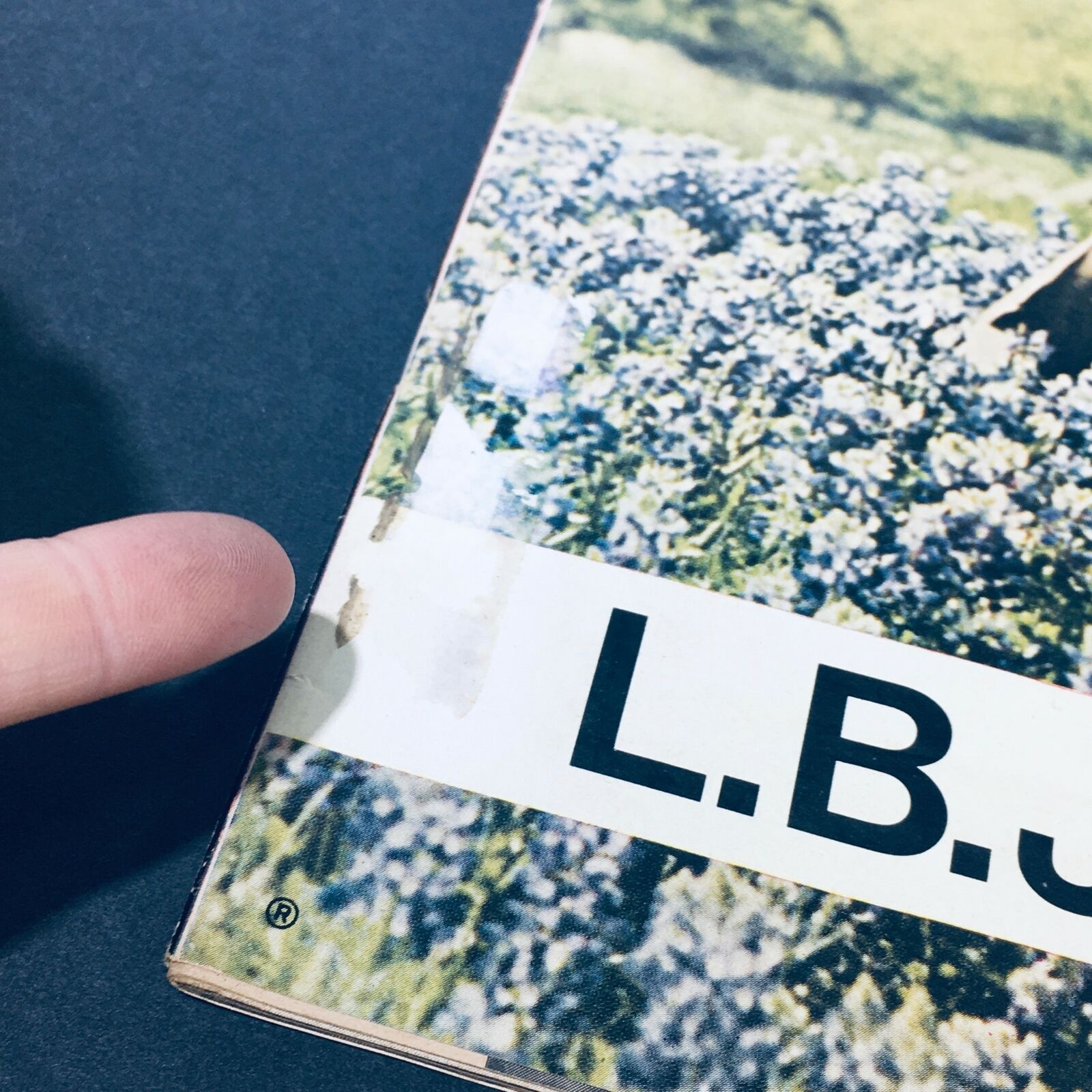 Close-up of the edge of the VTG Life Magazine May 21 1972 showing minor wear and a visible address label on the cover, emphasizing the magazine's used condition.