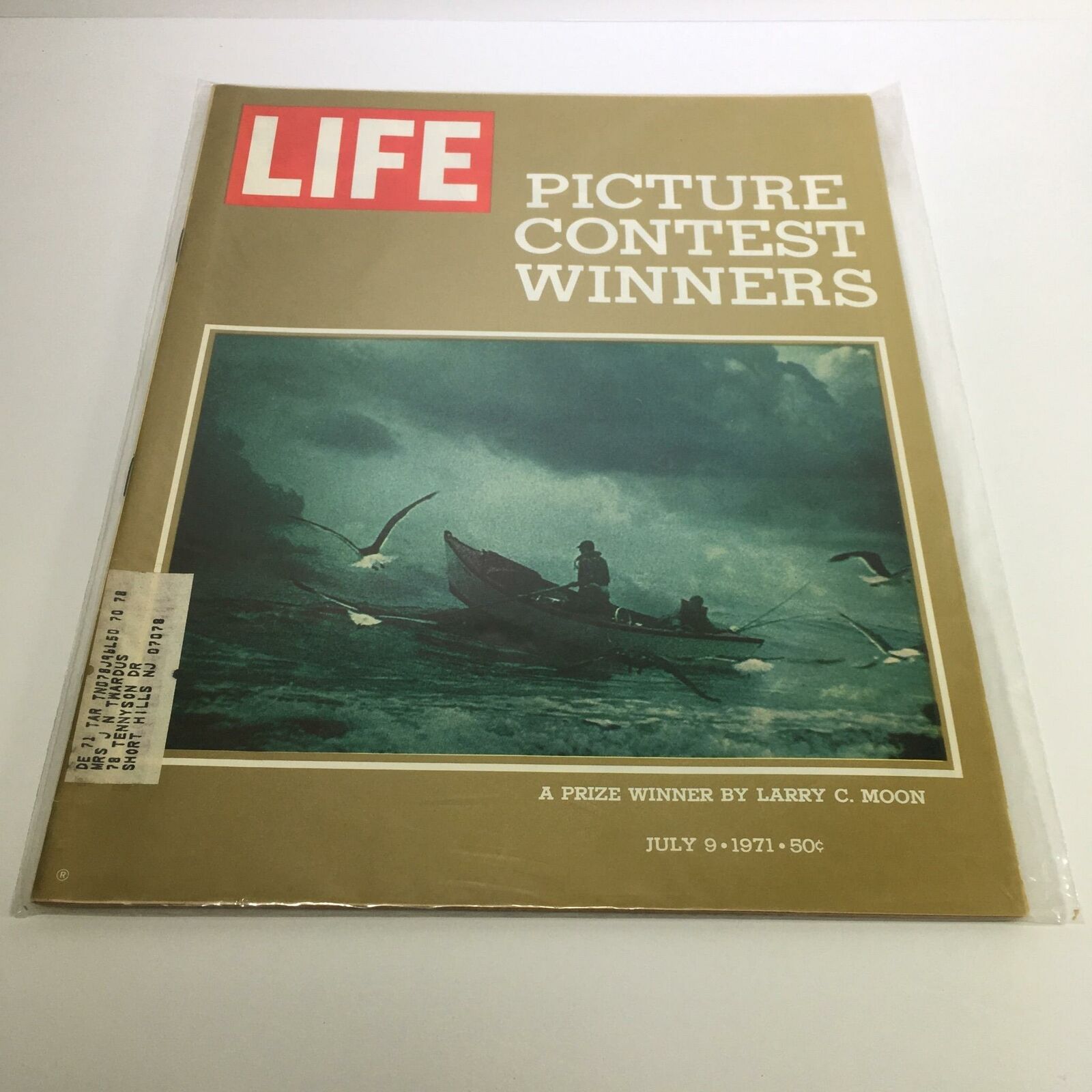 Cover of Life Magazine from July 9, 1971, featuring the article 'A Prize Winner' by Larry C. Moon, showcasing a vintage photo of a fishing scene with birds in flight, presented in good condition with protective plastic wrap.