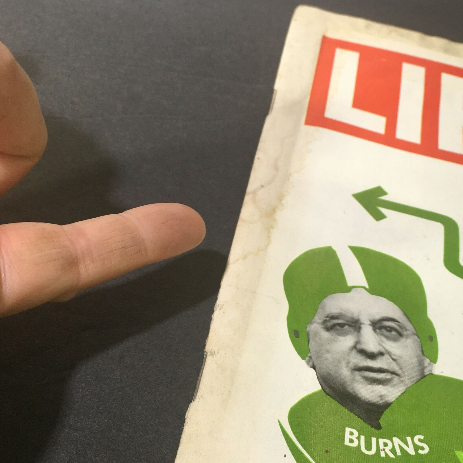 Close-up view of the VTG Life Magazine cover from August 26, 1971, showing Burns in a football uniform with dollar signs, illustrating the 'Game Plan for the Dollar' concept.