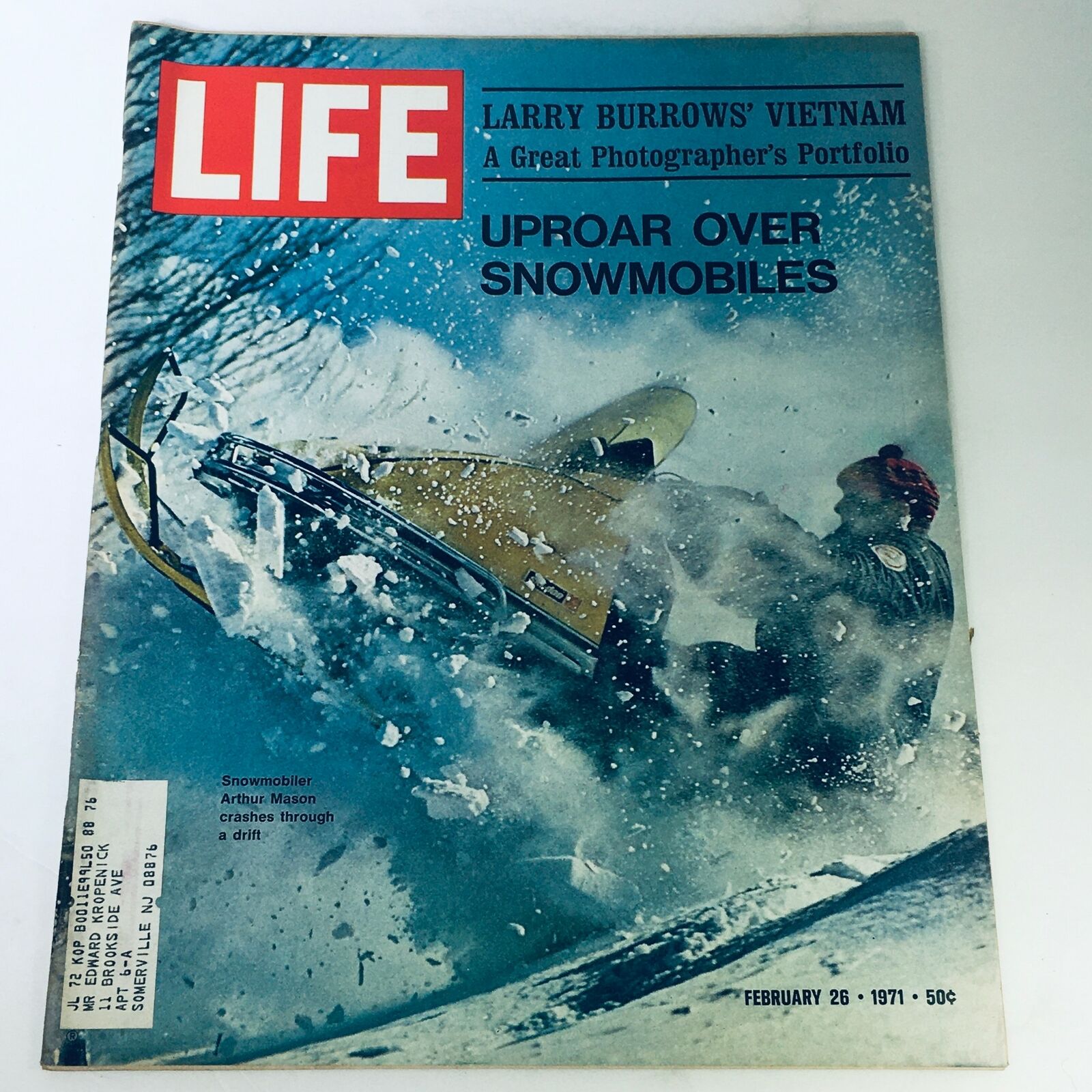 VTG Life Magazine February 26 1971 cover featuring the article 'Uproar Over Snowmobiles' by Arthur Mason, showcasing a snowmobiler crashing through snow and ice.