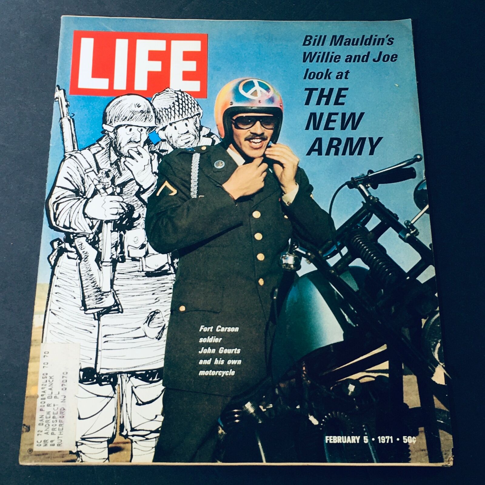 Cover of the VTG Life Magazine February 5 1971 featuring Bill Mauldin's Willie and Joe at The New Army, showcasing a soldier in uniform and motorcycle against a vibrant background.