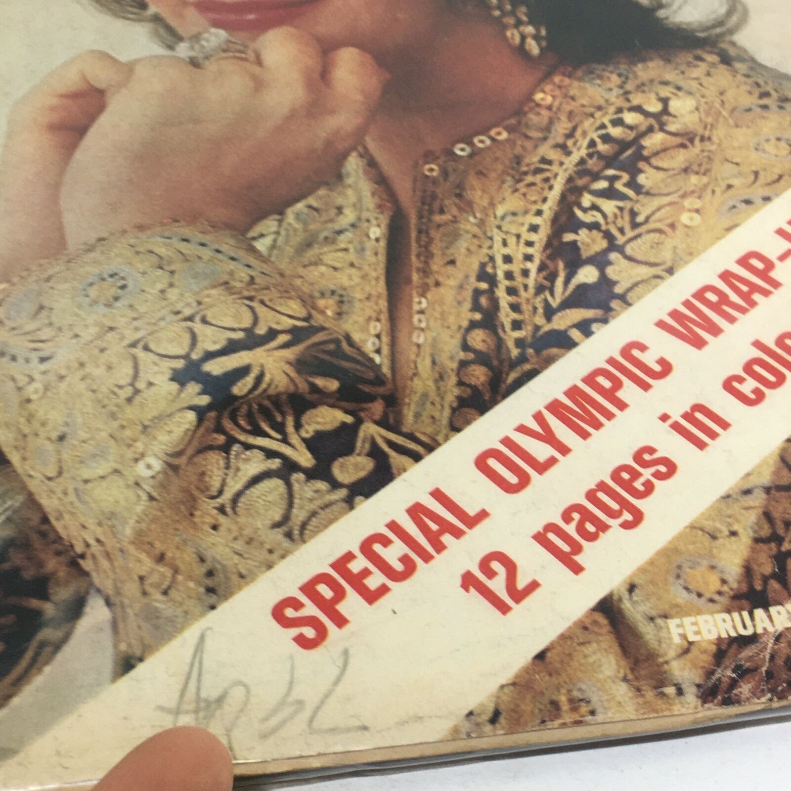Detail of the cover of VTG Life Magazine: February 25 1972, showcasing Liz Taylor's ornate dress and the 'Special Olympic Wrap-Up' text.