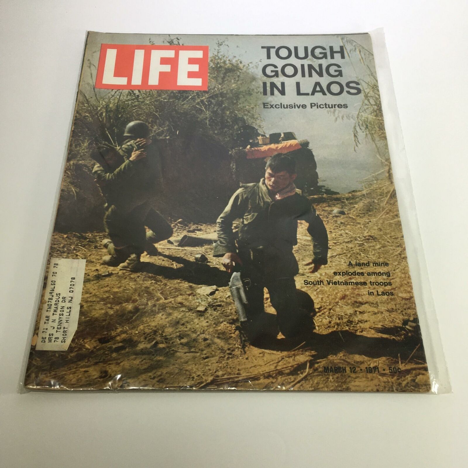 Cover of Life Magazine from March 12, 1971, featuring the title 'A Land Mine Explodes Among South Vietnamese Troops' with imagery depicting the challenges faced by soldiers in Laos.