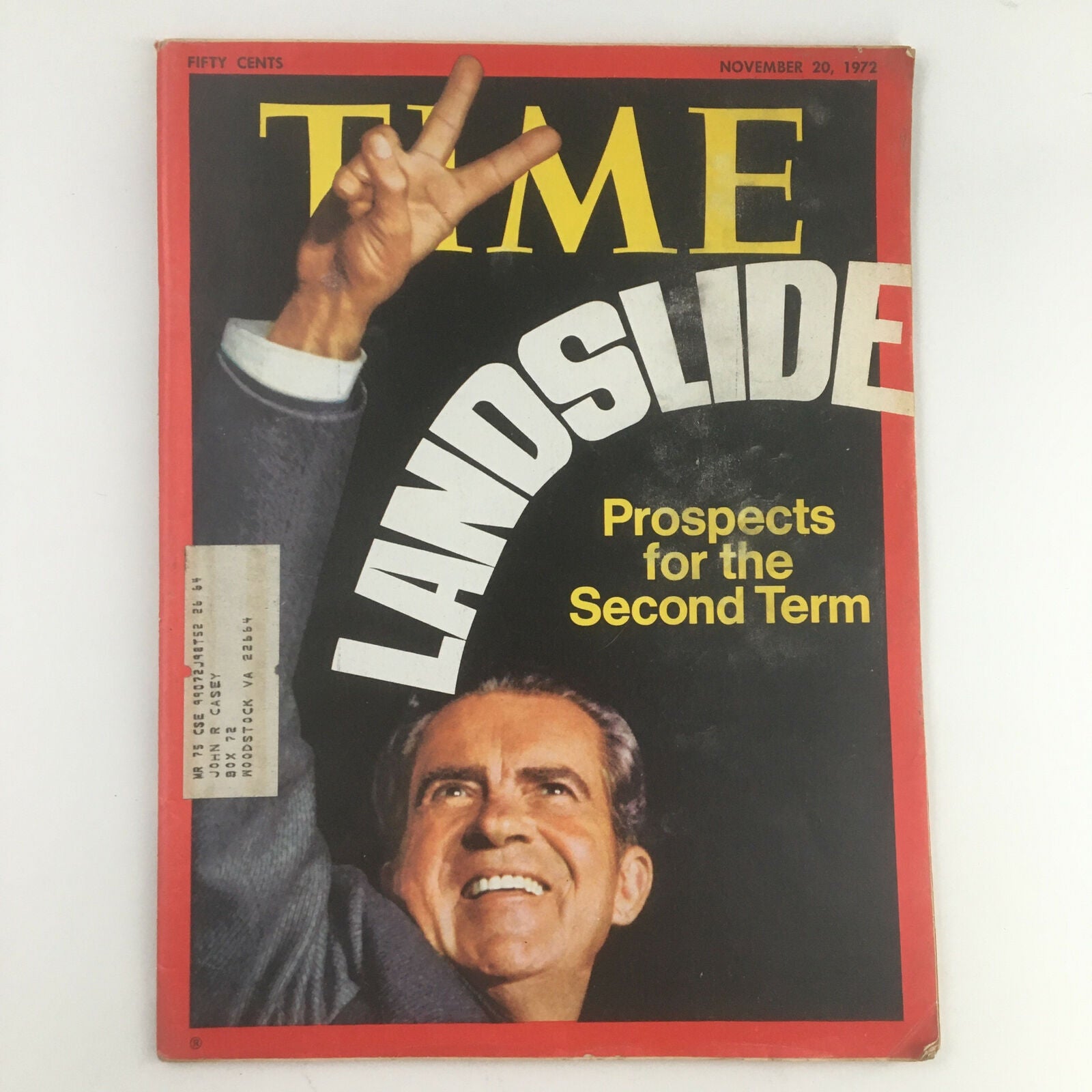 Cover of Time Magazine from November 20, 1972, featuring a large headline reading 'LANDSLIDE' and capturing the prospects for Richard Nixon's second term in office, showcasing his victorious pose with a peace sign.