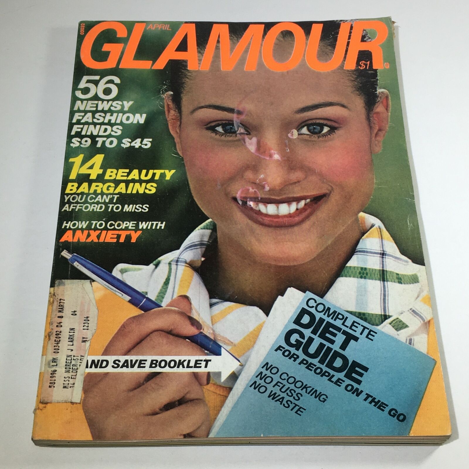 Vintage Glamour Magazine April 1976 cover featuring a smiling woman with a pencil and a diet guide, highlighting 56 fashion finds and beauty bargains. Celebrate the fashion and cultural trends of the 1970s with this collectible issue.