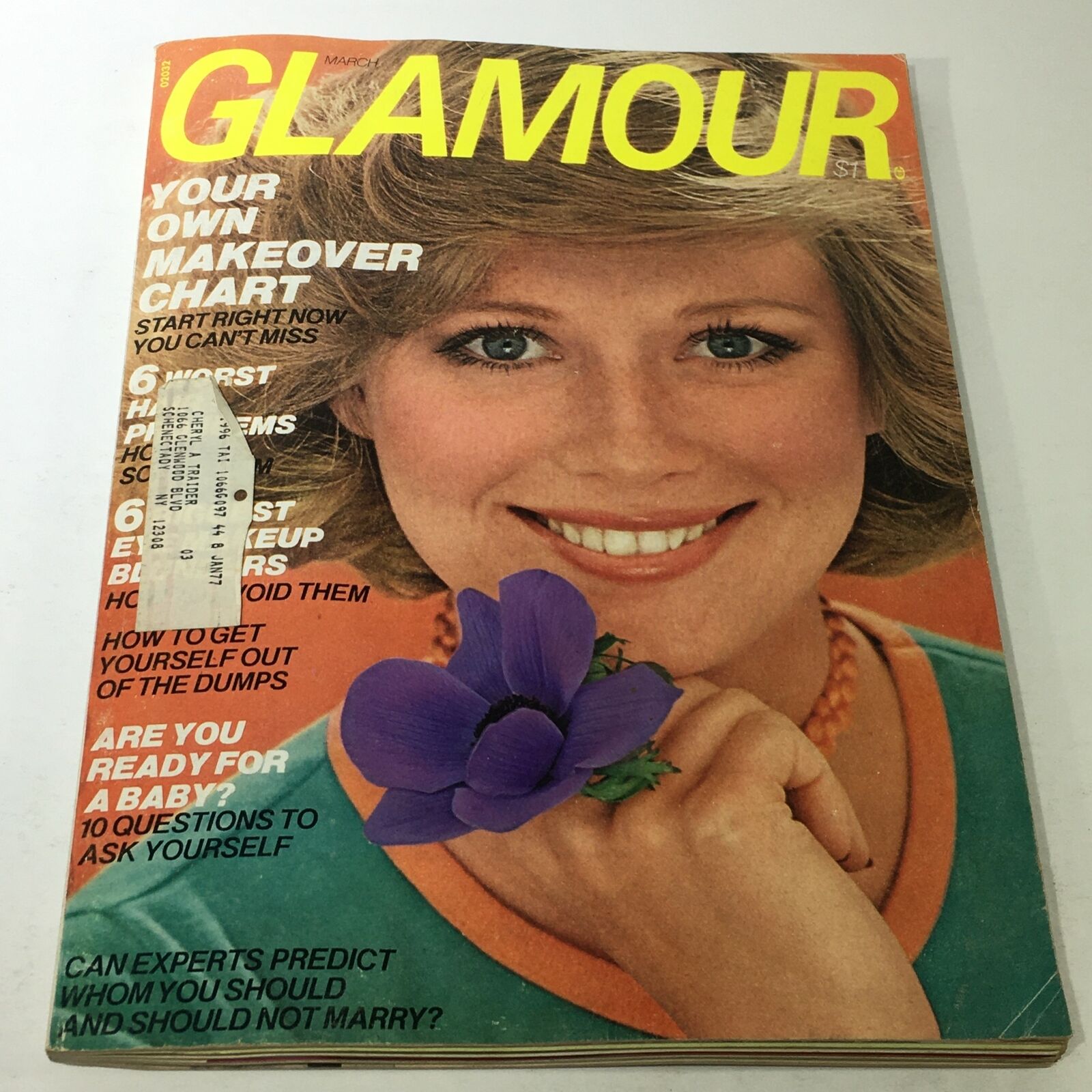 Glamour Magazine cover from March 1976 featuring Shaun Casey, highlighting beauty and fashion trends of the 1970s with a smiling woman holding a purple flower.