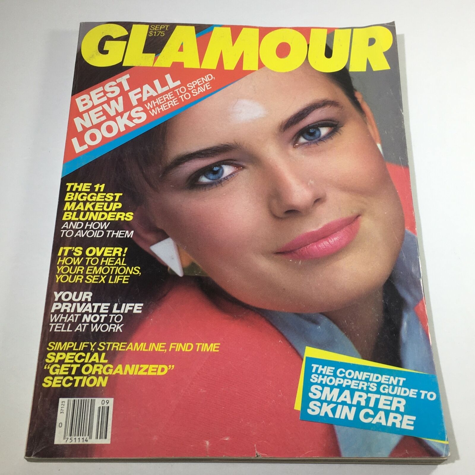 Cover of VTG Glamour Magazine: September 1983 featuring a model with blue eyes and pink lips showcasing fall fashion trends, surrounded by articles about makeup tips, emotional healing, and organization.