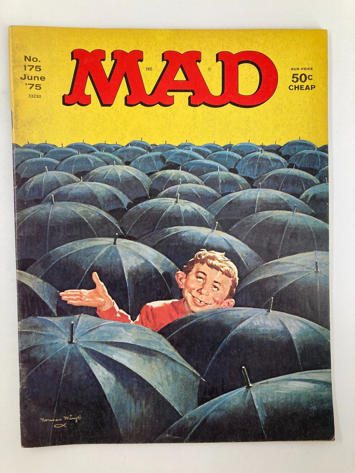 Mad Magazine June 1975 No. 175 featuring a whimsical cover illustration of a character smiling amidst a sea of blue umbrellas, reflecting the humor and satire of the iconic magazine.