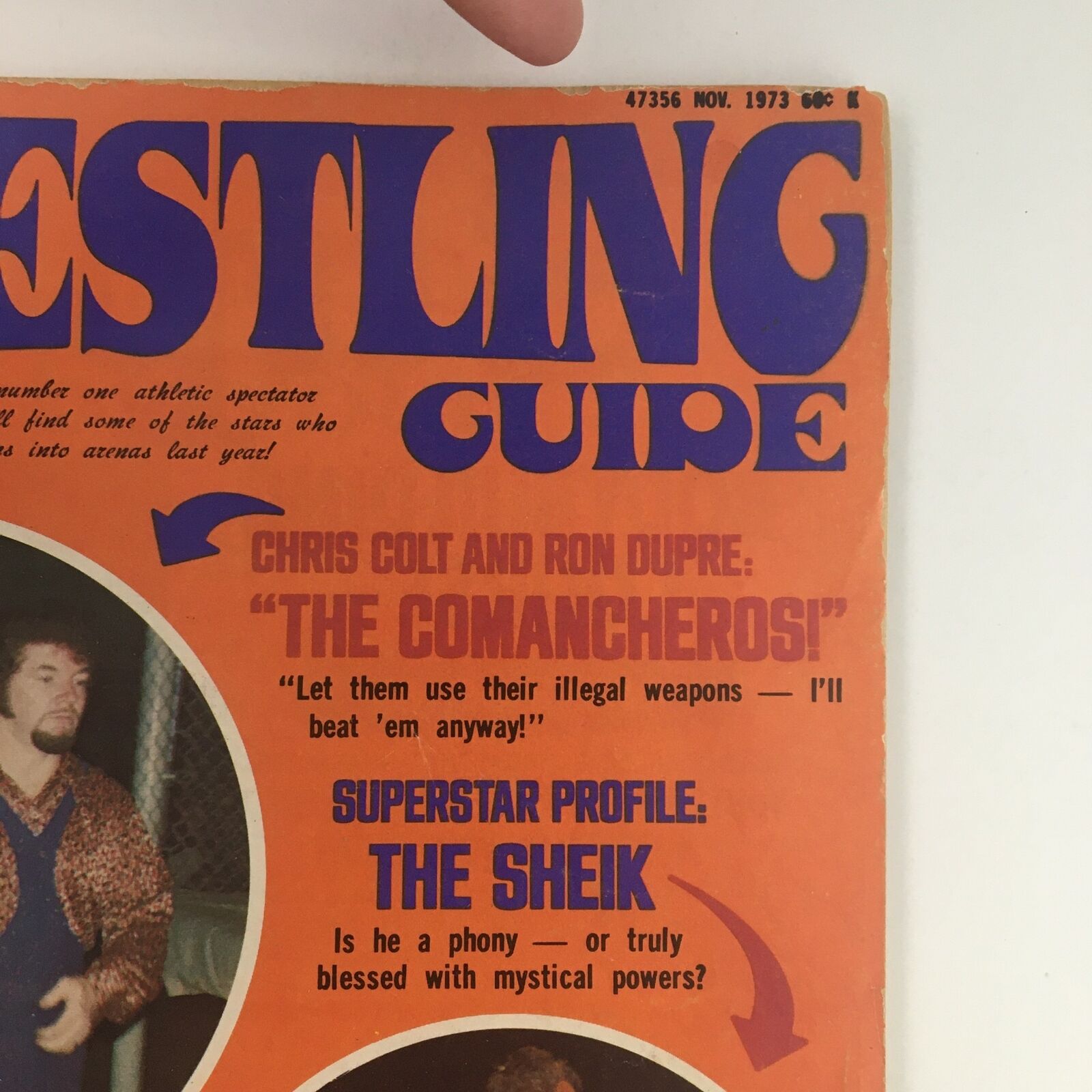 Close-up of the Wrestling Guide Magazine November 1973 cover, highlighting profiles of Chris Colt and Ron Dupre, featuring The Sheik in a vintage wrestling layout.