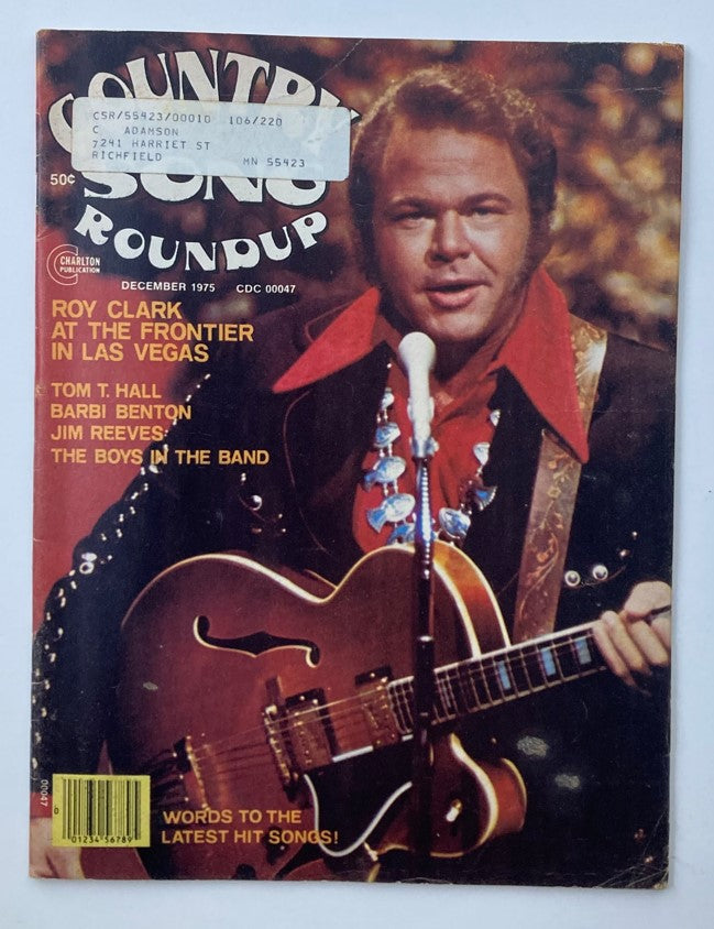 Cover of VTG Country Song Roundup Magazine from December 1975 featuring Roy Clark at The Frontier in Las Vegas. The magazine showcases classic country music culture with highlights including Tom T. Hall, Barbi Benton, and Jim Reeves, making it a collectible for country music enthusiasts.