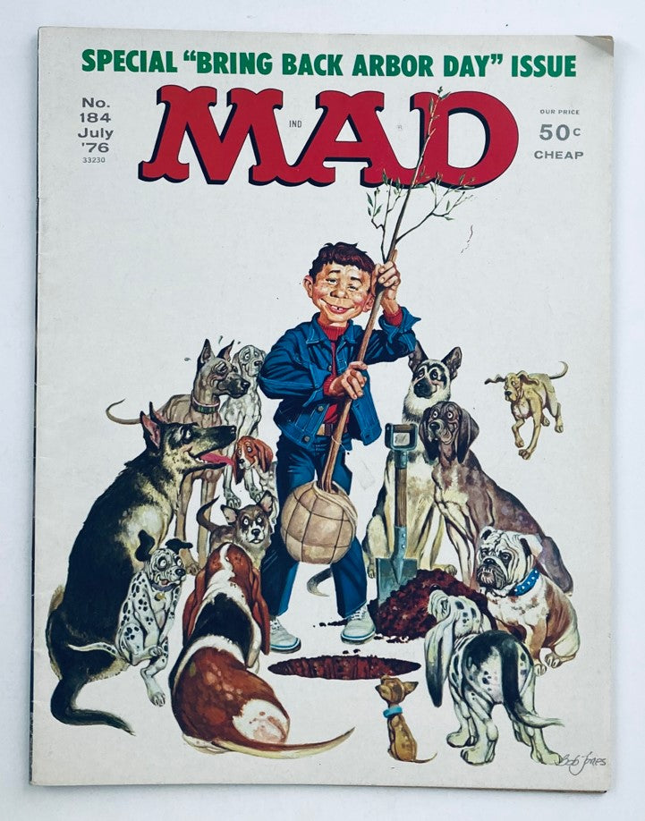Cover of Mad Magazine July 1976 No. 184 - Bring Back Arbor Day featuring a boy surrounded by various dogs, embodying the humorous and whimsical nature of the magazine.