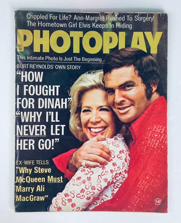 VTG Photoplay Magazine December 1972 featuring Burt Reynolds and Dinah Shore on the cover. The magazine highlights classic Hollywood with a colorful cover showing the famous duo embraced. Perfect for vintage magazine collectors.