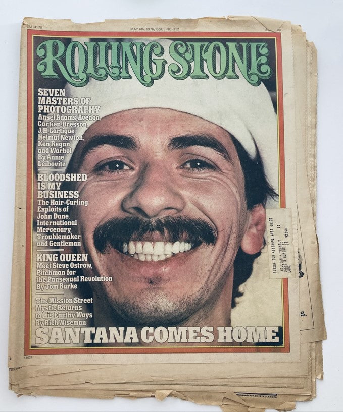 Cover of Rolling Stone Magazine, May 6, 1976, issue No. 212 featuring the headline 'Santana Comes Home' with a smiling portrait of Santana member, representing a significant moment in music history.